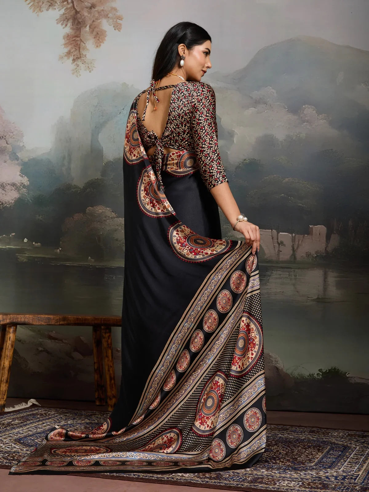 Tarani saree back view with printed back tie-up blouse and flowing drape