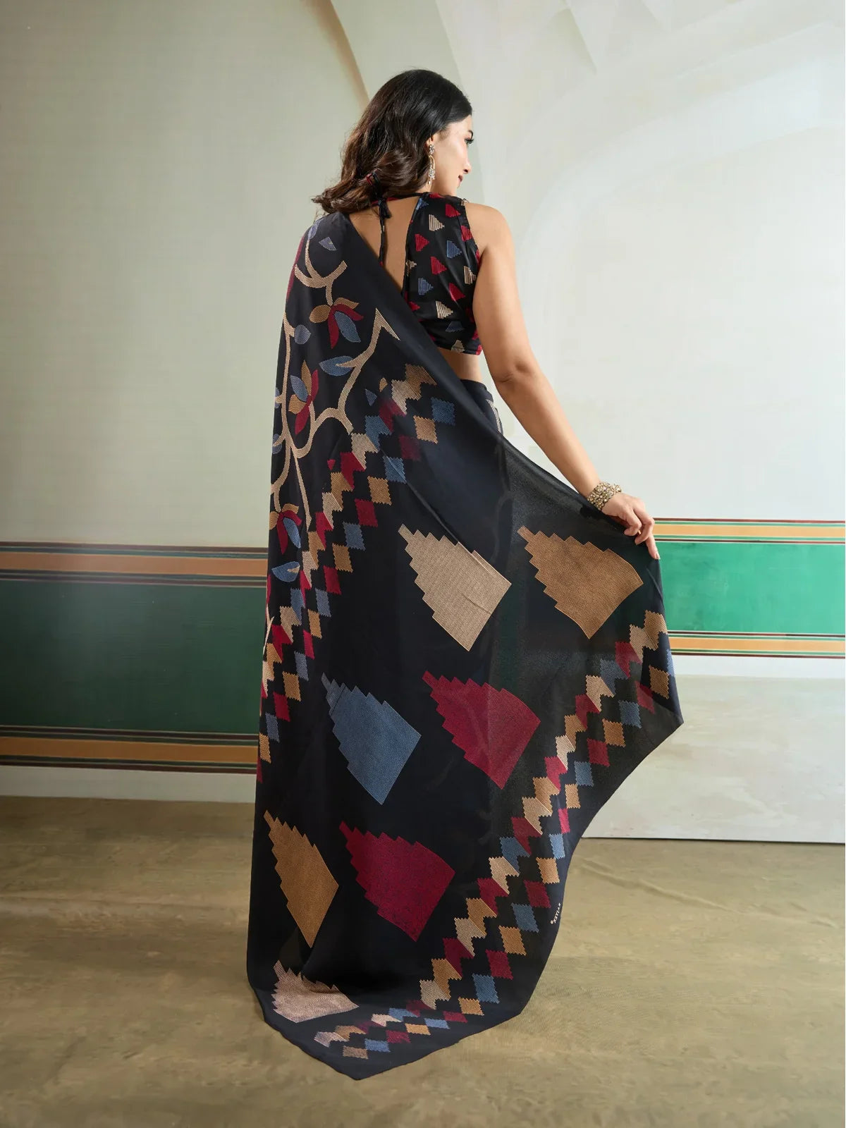 Back view of Tarani modal satin black saree with contrast multicolor patterns and blouse design