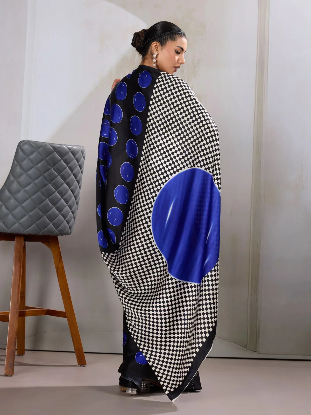 Tarani back view showing large dot and check pattern layout on the saree pallu