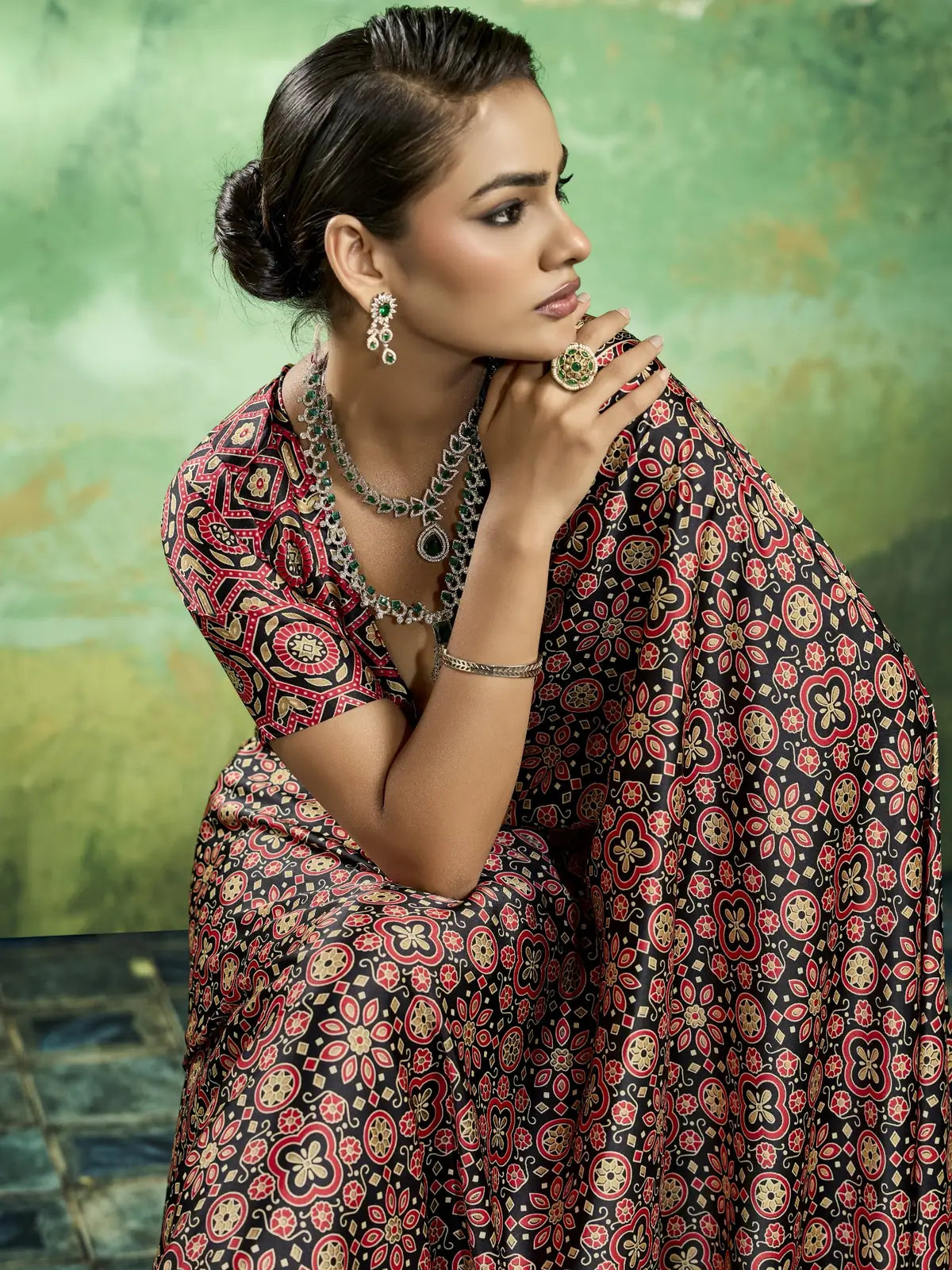 Tarani closeup view of black modal satin Ajrakh print saree with intricate traditional motifs