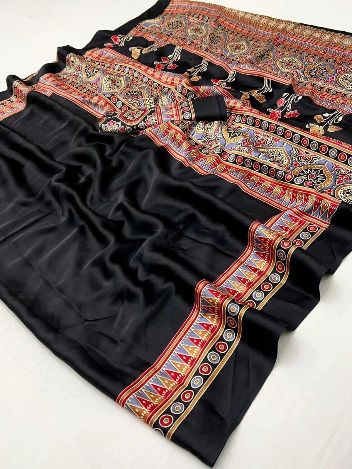 Tarani saree detailed fabric texture close-up in modal satin with ethnic border and Ajrakh art