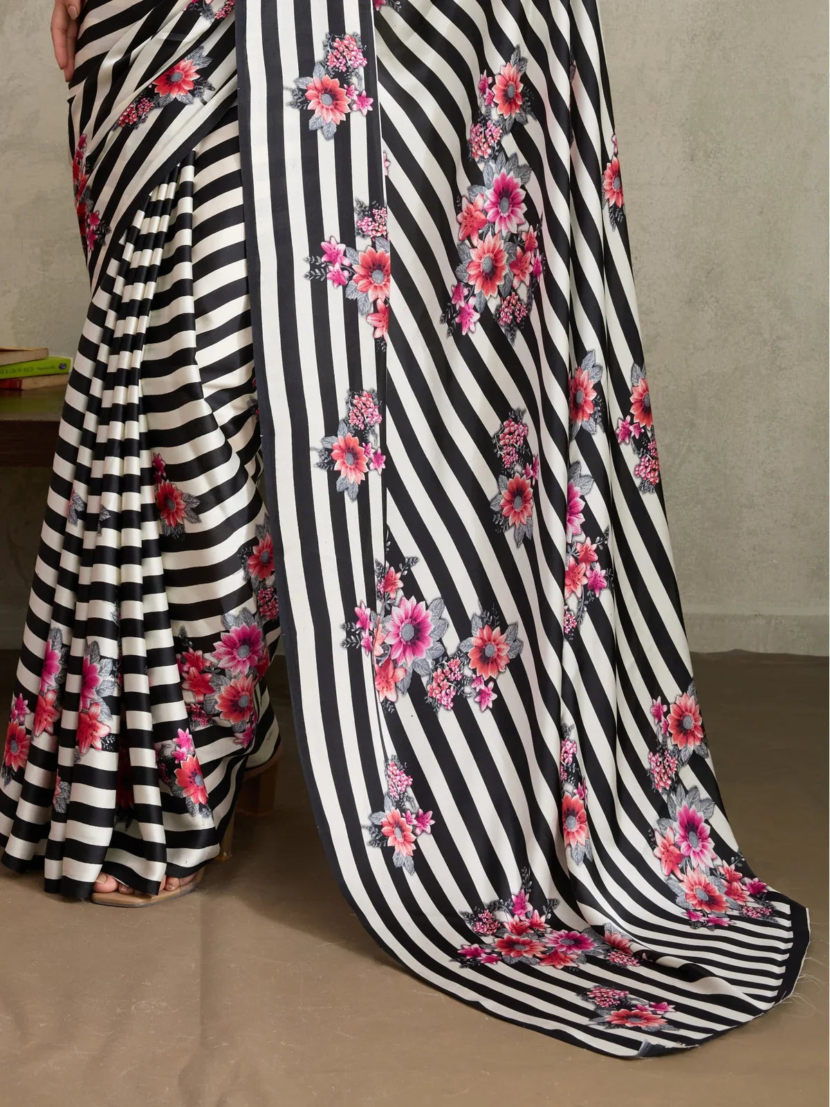 Tarani modal satin saree fabric in black white stripe with bright pink floral print closeup detail