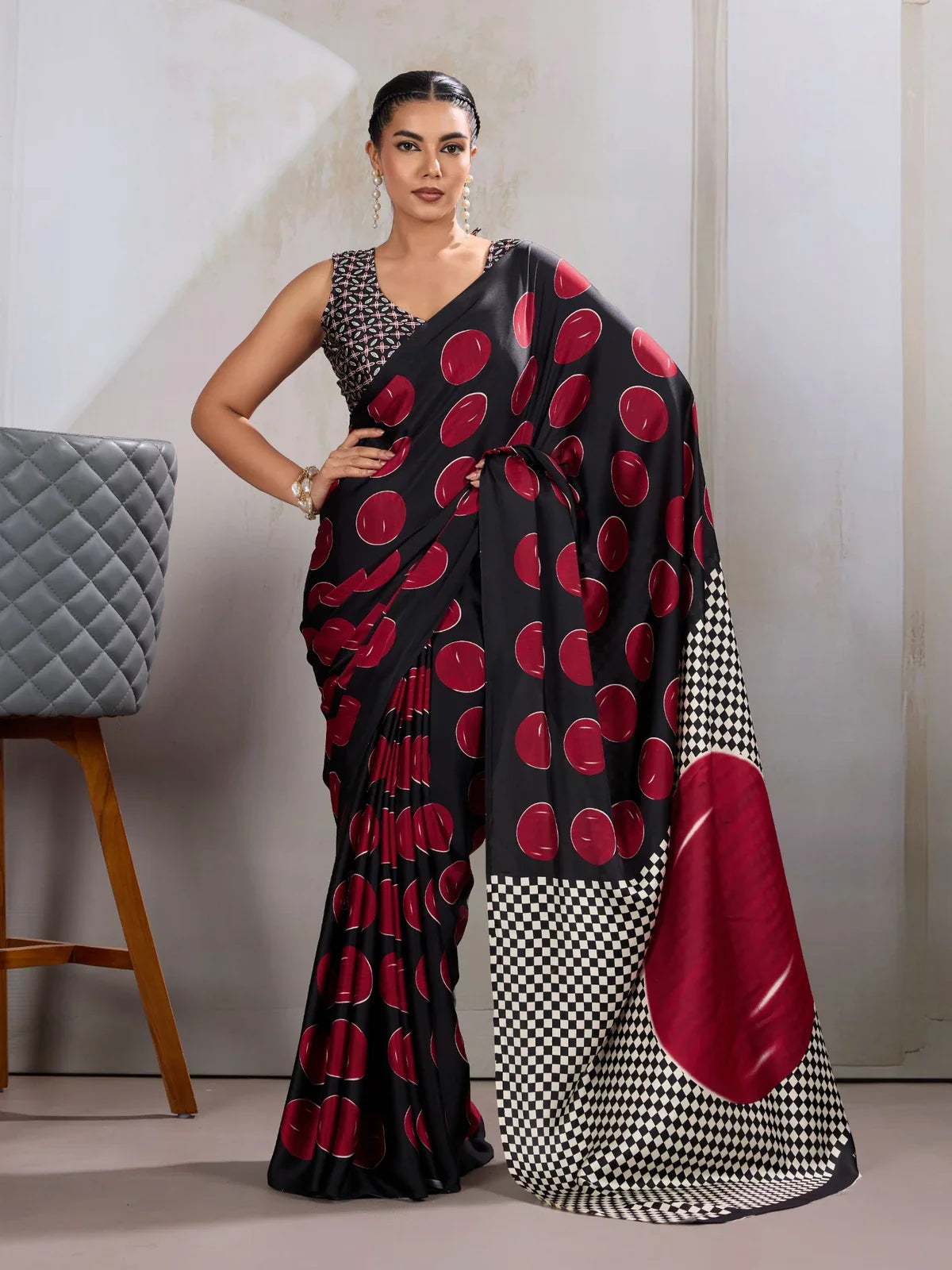 Tarani black modal satin saree full view with bold red Ajrakh print and checkered pallu