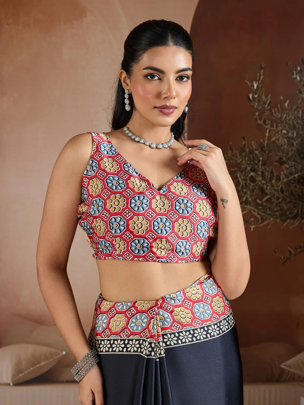 Tarani designer black modal satin saree blouse close-up with red and yellow multicolor ajrakh print