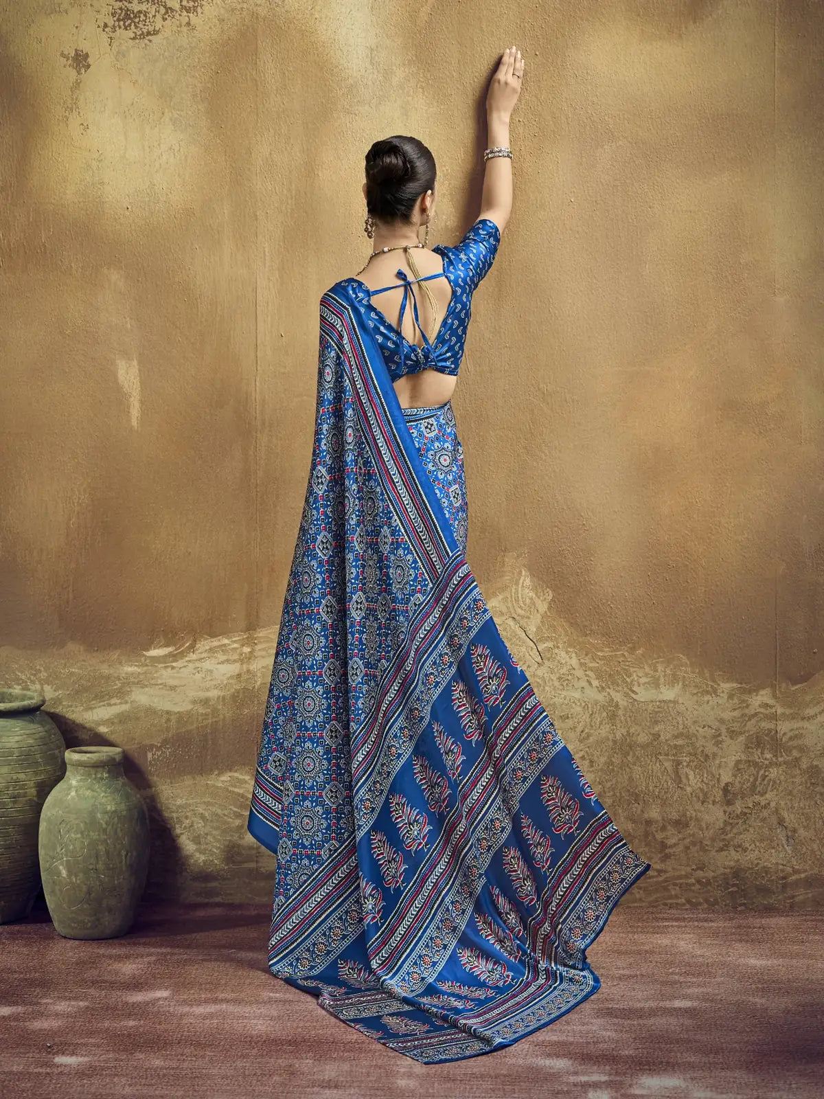 Tarani blue Ajrakh print saree back blouse design view with elegant pallu styling by Tarani