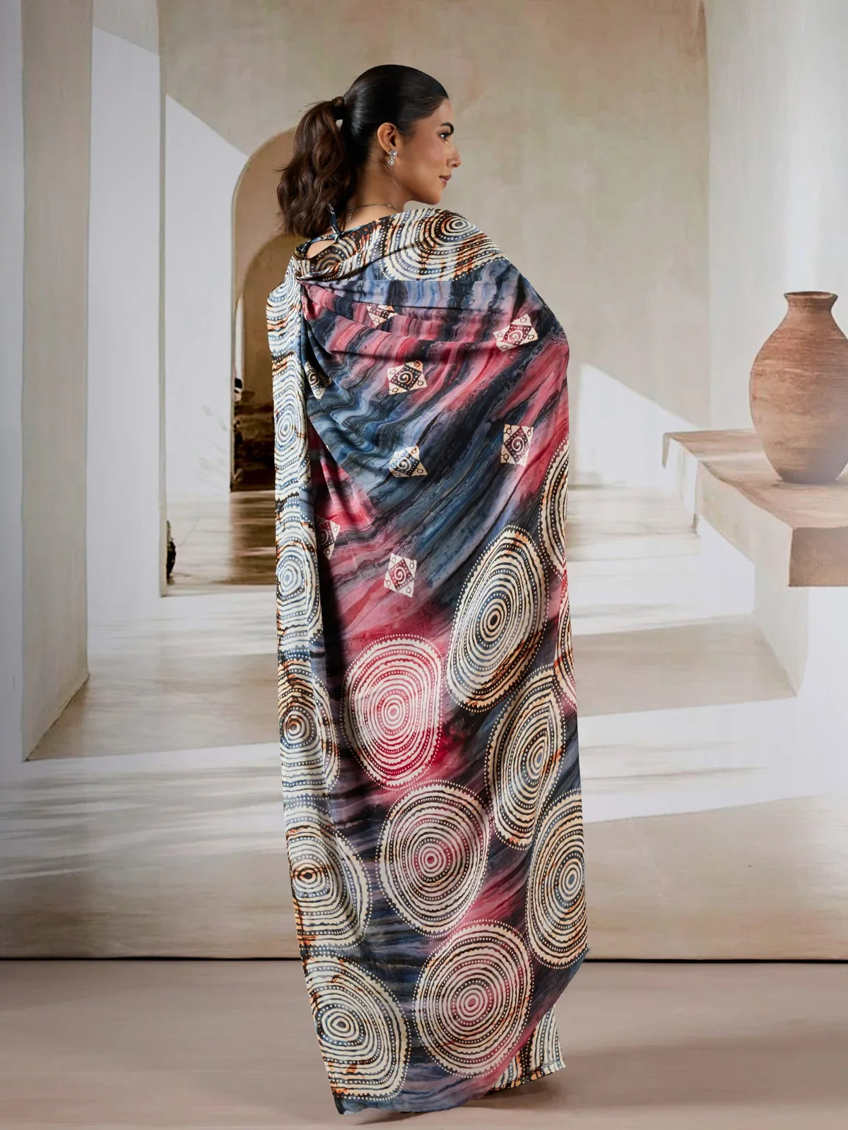 Tarani modal satin Ajrakh saree back view with artistic flow and deep color contrast