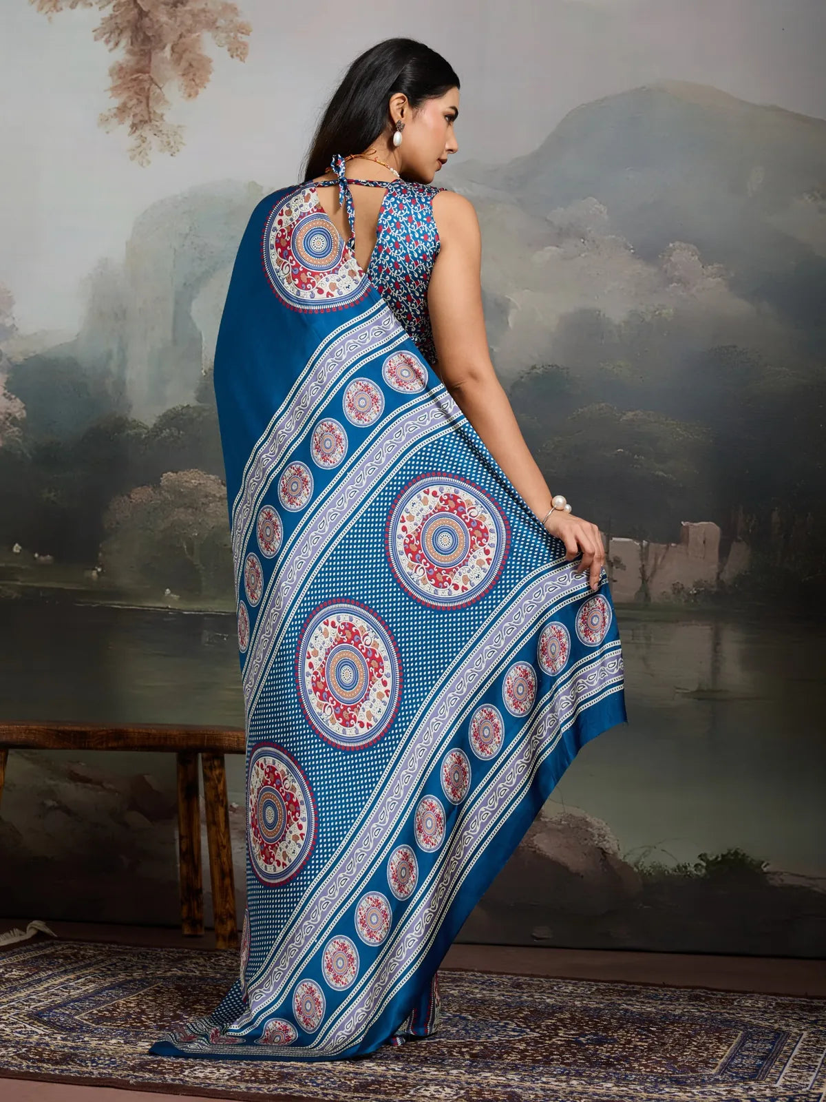 Back view of Tarani modal satin blue saree with mandala Ajrakh designs and graceful fall
