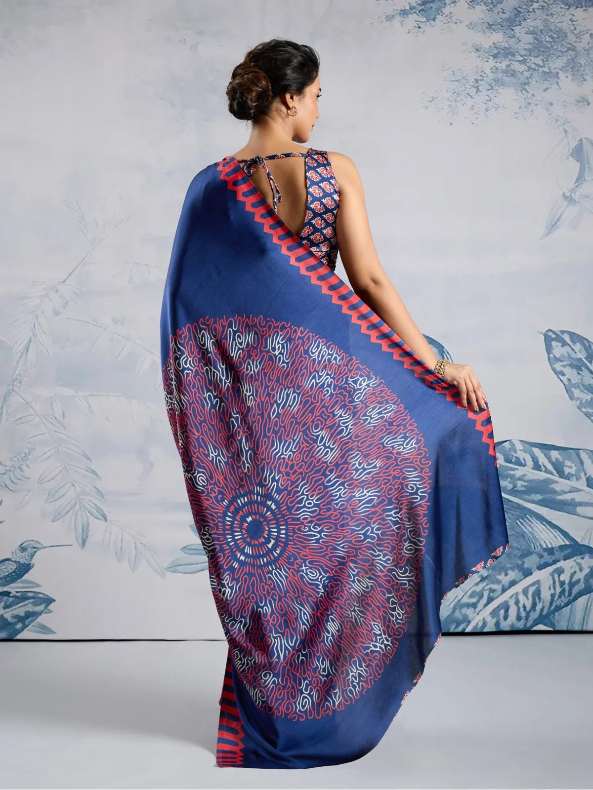 Tarani full back view of modal satin blue saree showing ajrakh detailing and printed blouse style