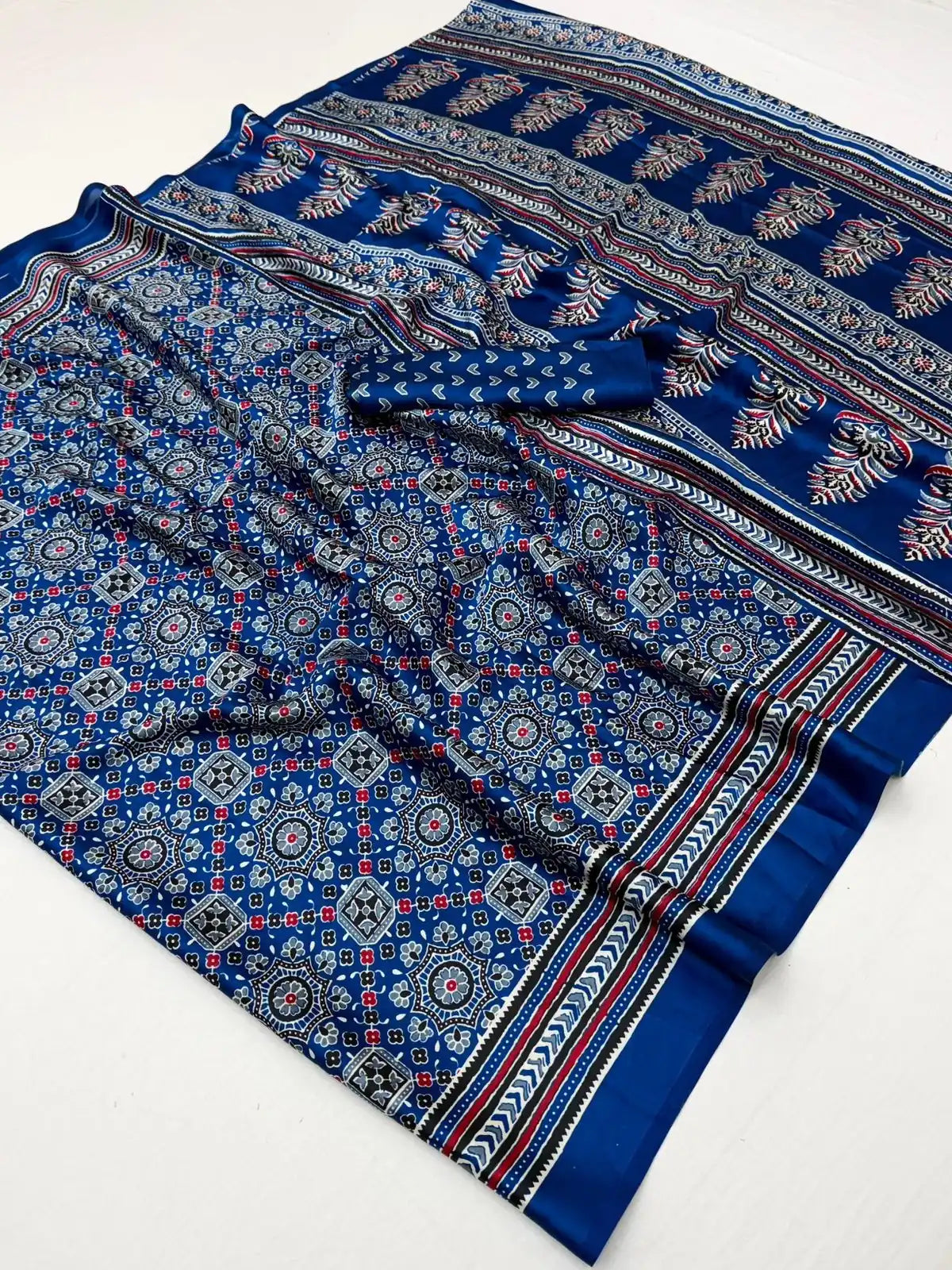 Tarani blue modal satin Ajrakh print saree fabric closeup with blouse piece and border detailing