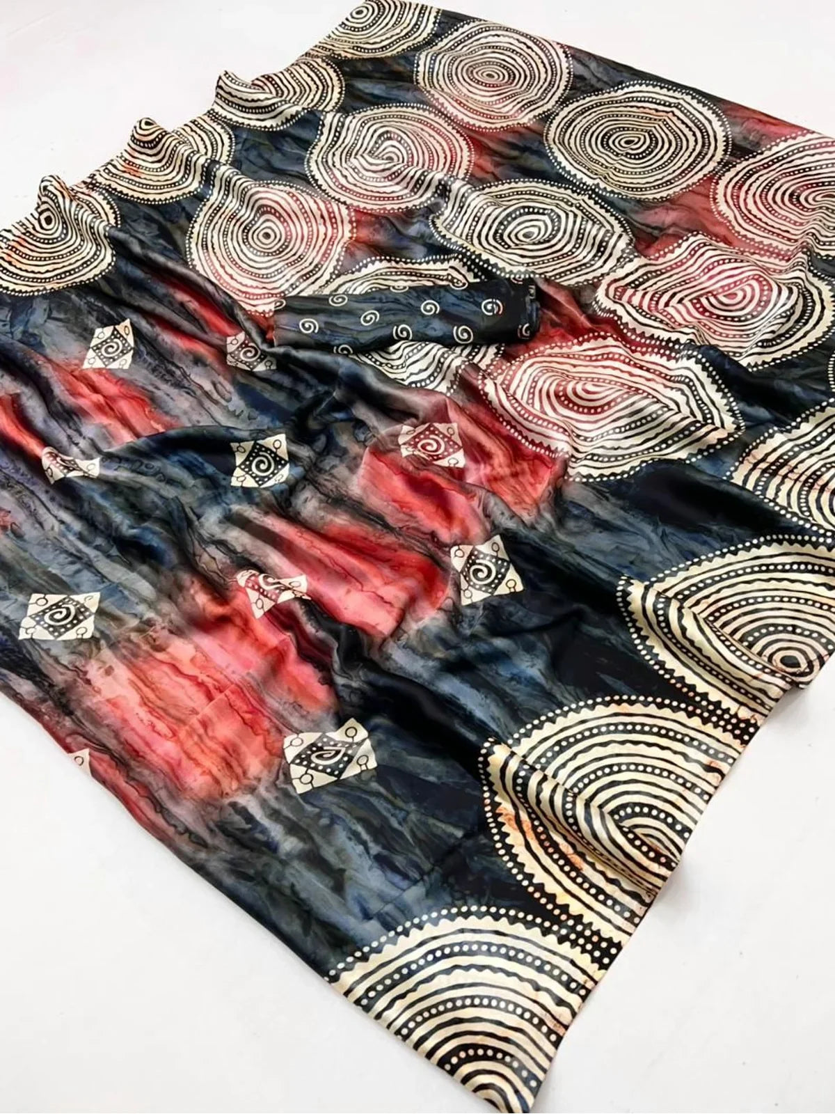 Tarani modal satin saree fabric close-up with Ajrakh spirals and wave patterns