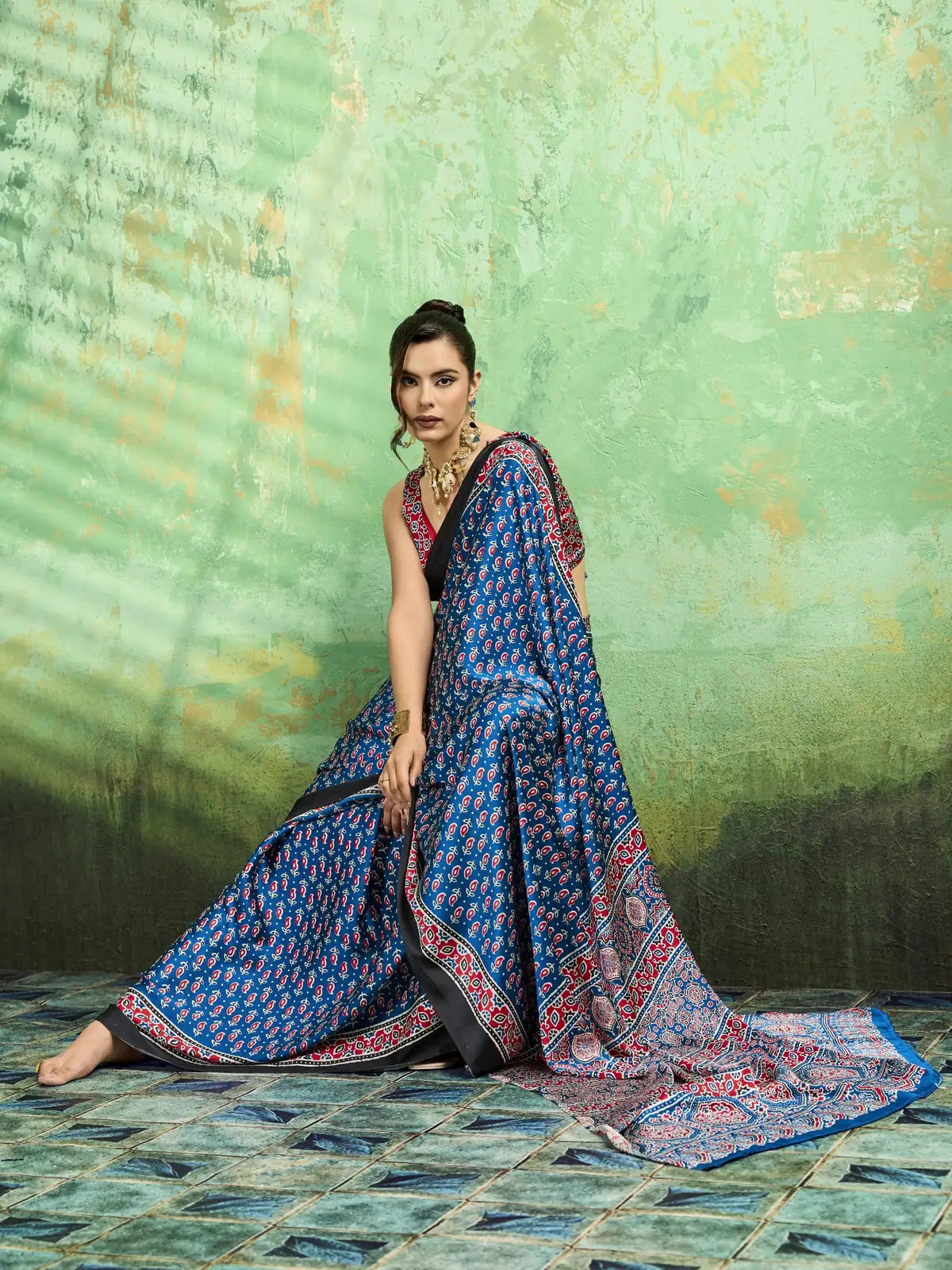 Tarani blue modal satin Ajrakh print saree front pose showcasing elegant drape and border