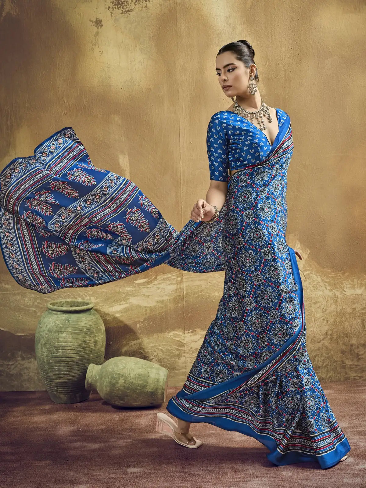 Tarani blue modal satin Ajrakh print saree pallu view with detailed border and flowing drape