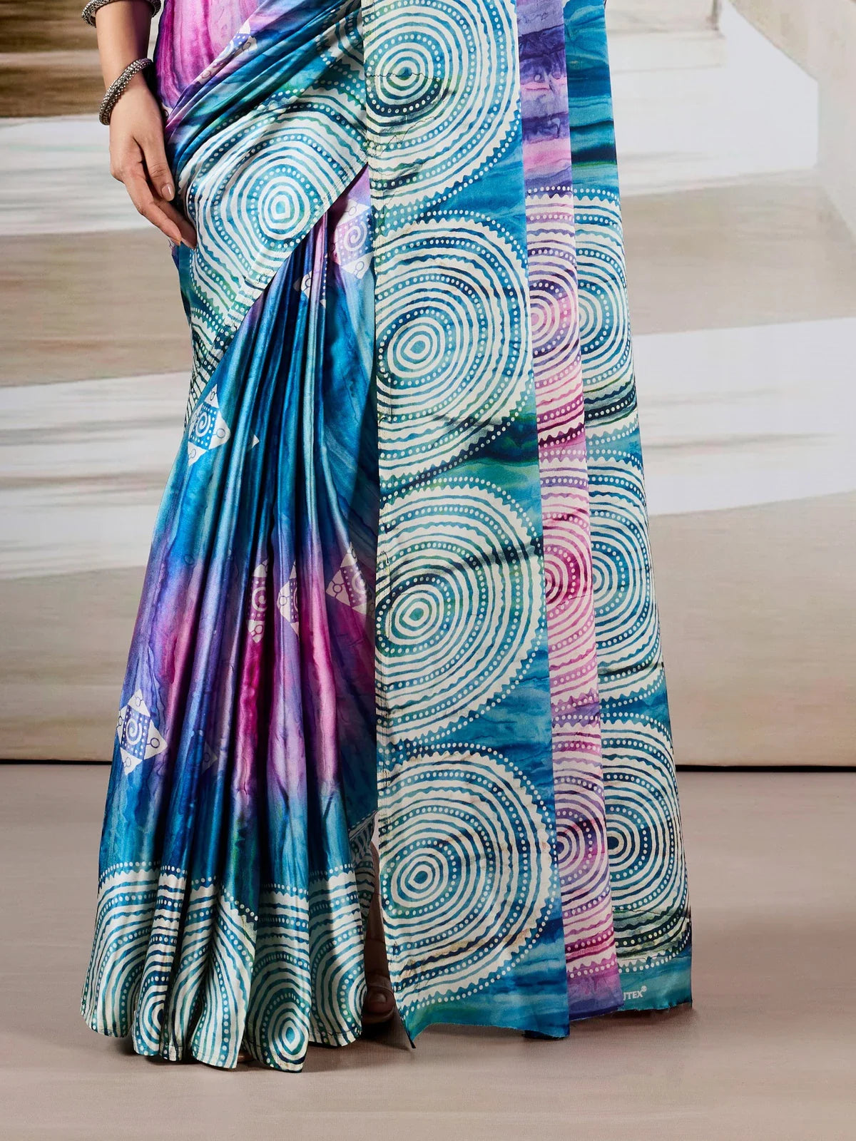 Tarani modal satin saree pallu and border view with circular Ajrakh patterns in blue and magenta