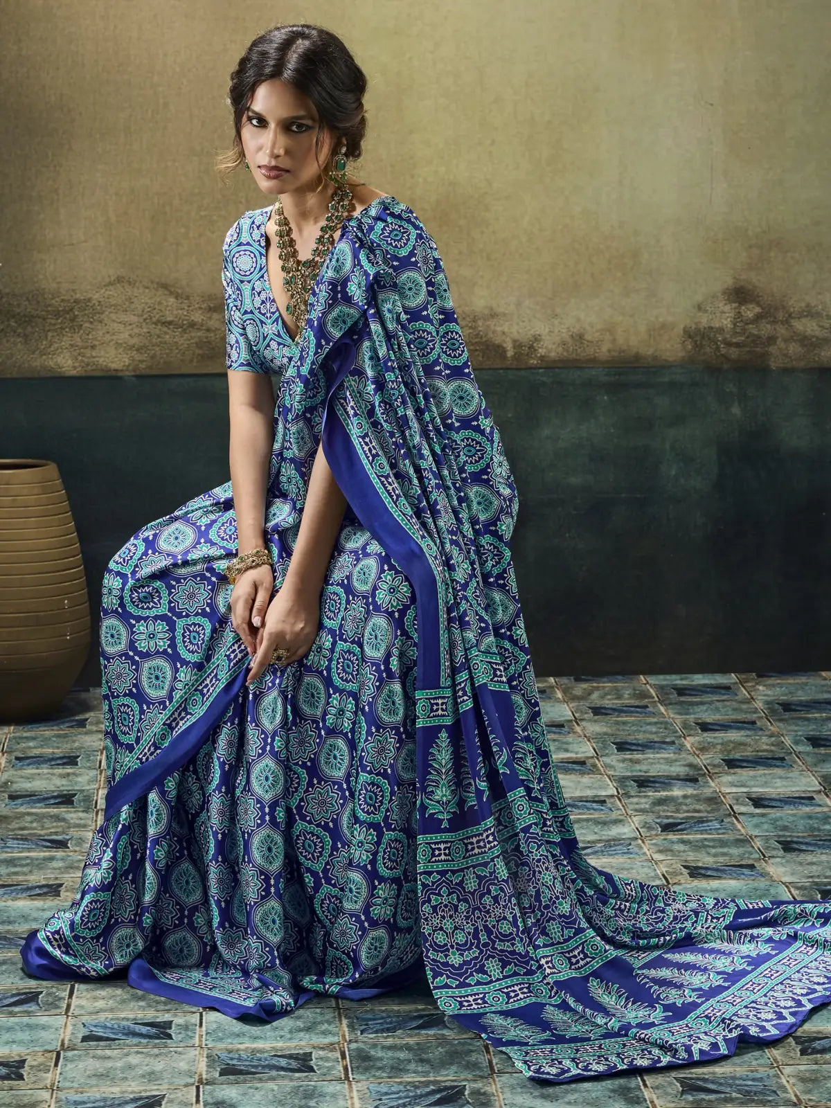 Tarani Swarnima blue Modal Satin Ajrakh print saree in graceful side pose