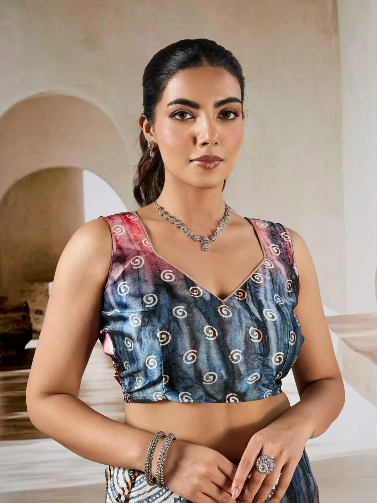 Tarani modal satin blouse close-up with indigo and rust hand prism swirl print