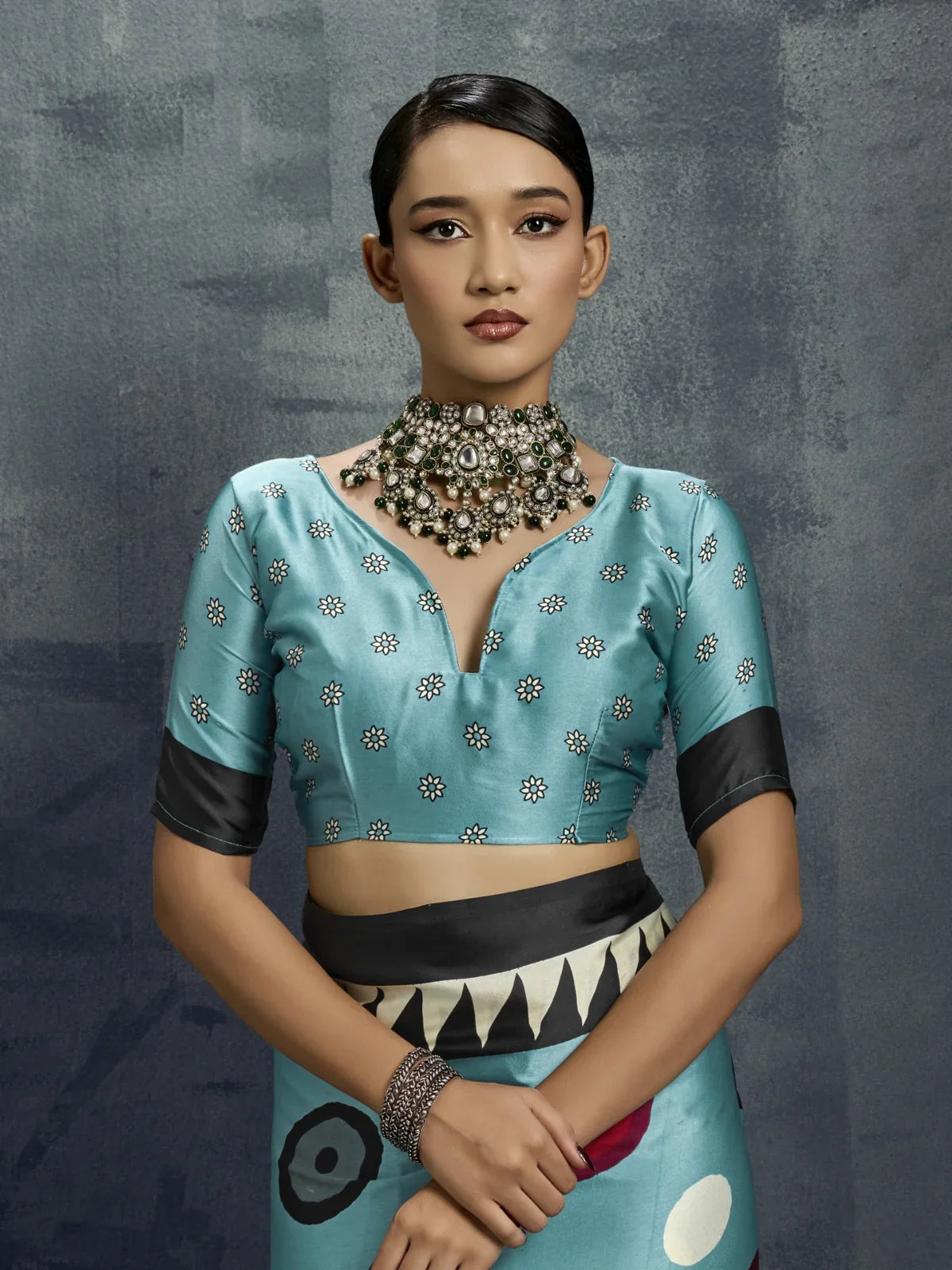 Tarani blue modal satin saree closeup upper body with printed blouse and elegant neckline