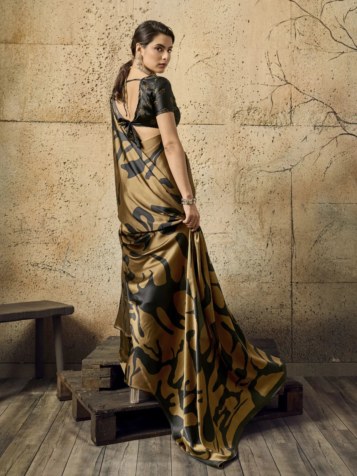 Tarani brown modal satin Ajrakh print saree back view with stylish blouse pattern and pallu design