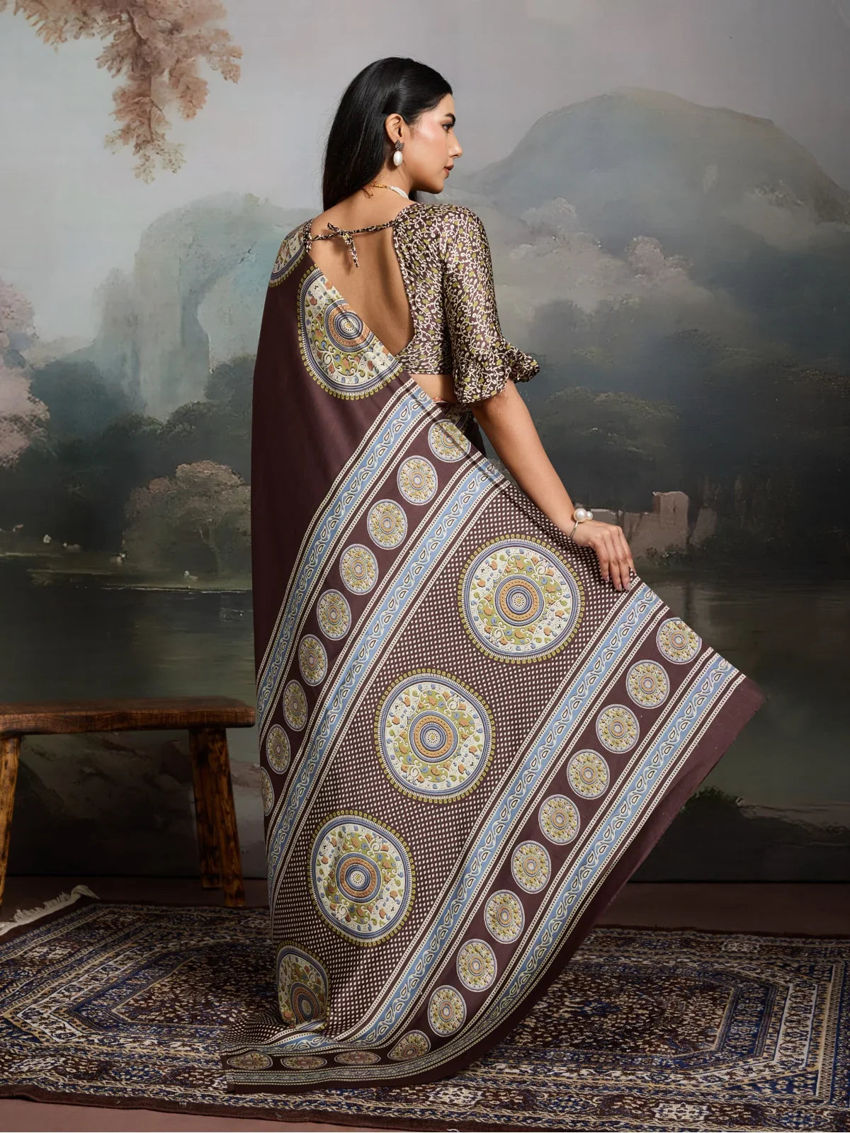 Tarani back view of brown ajrakh saree with stylish printed blouse and open neckline design
