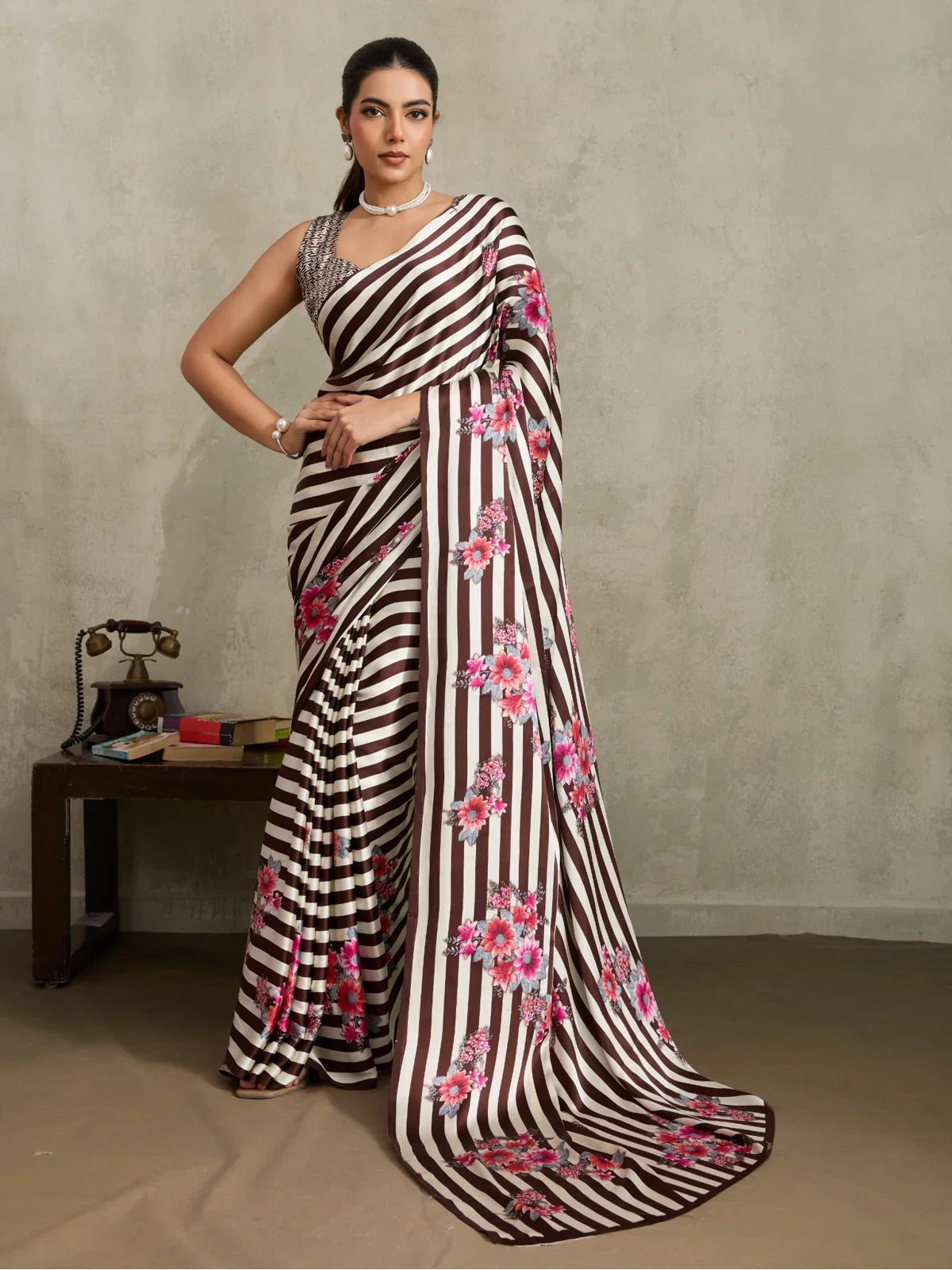 Tarani modal satin brown striped saree with floral print shown in full view with elegant drape