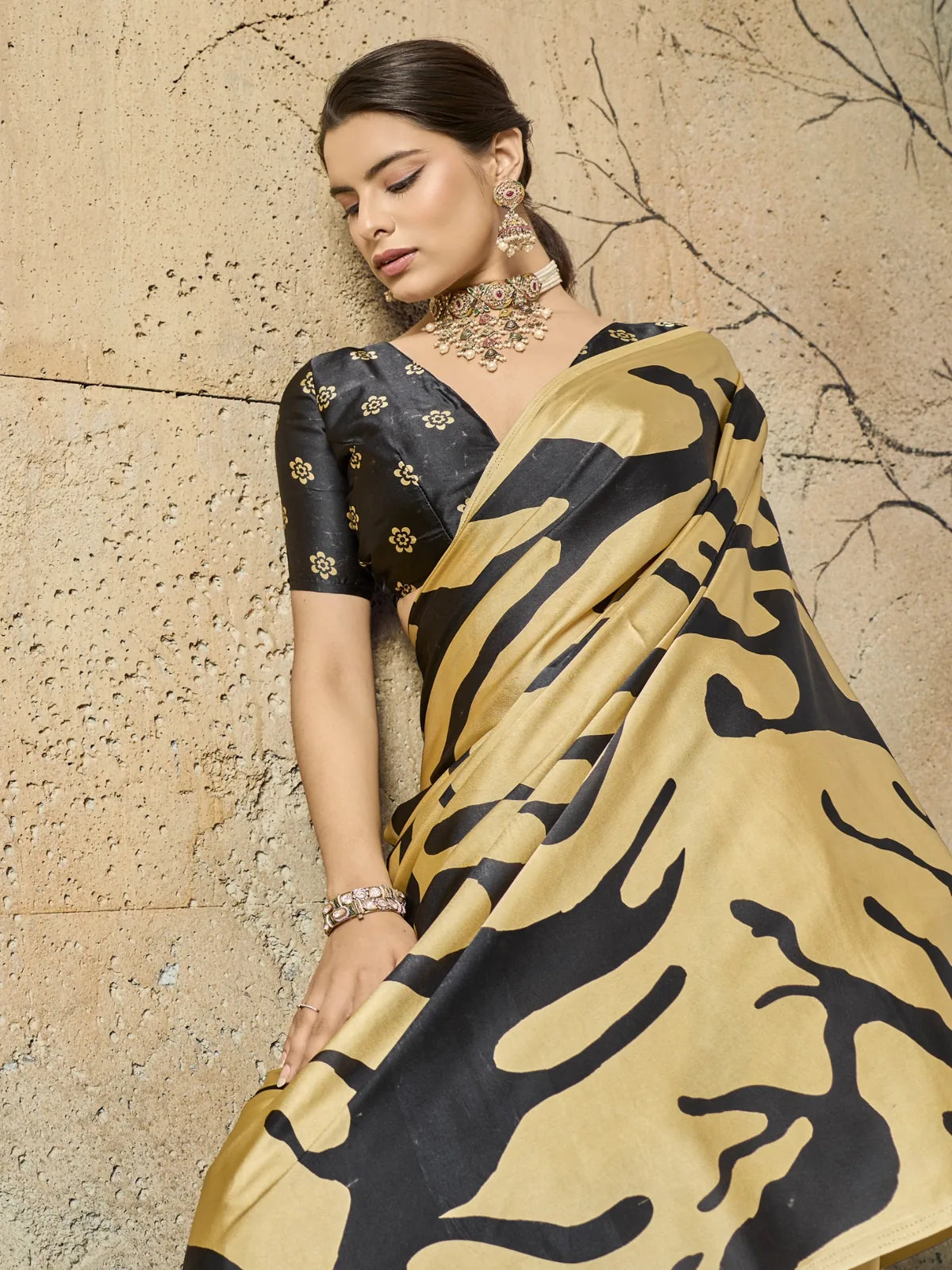 Tarani modal satin golden saree closeup view with bold Ajrakh print and elegant blouse