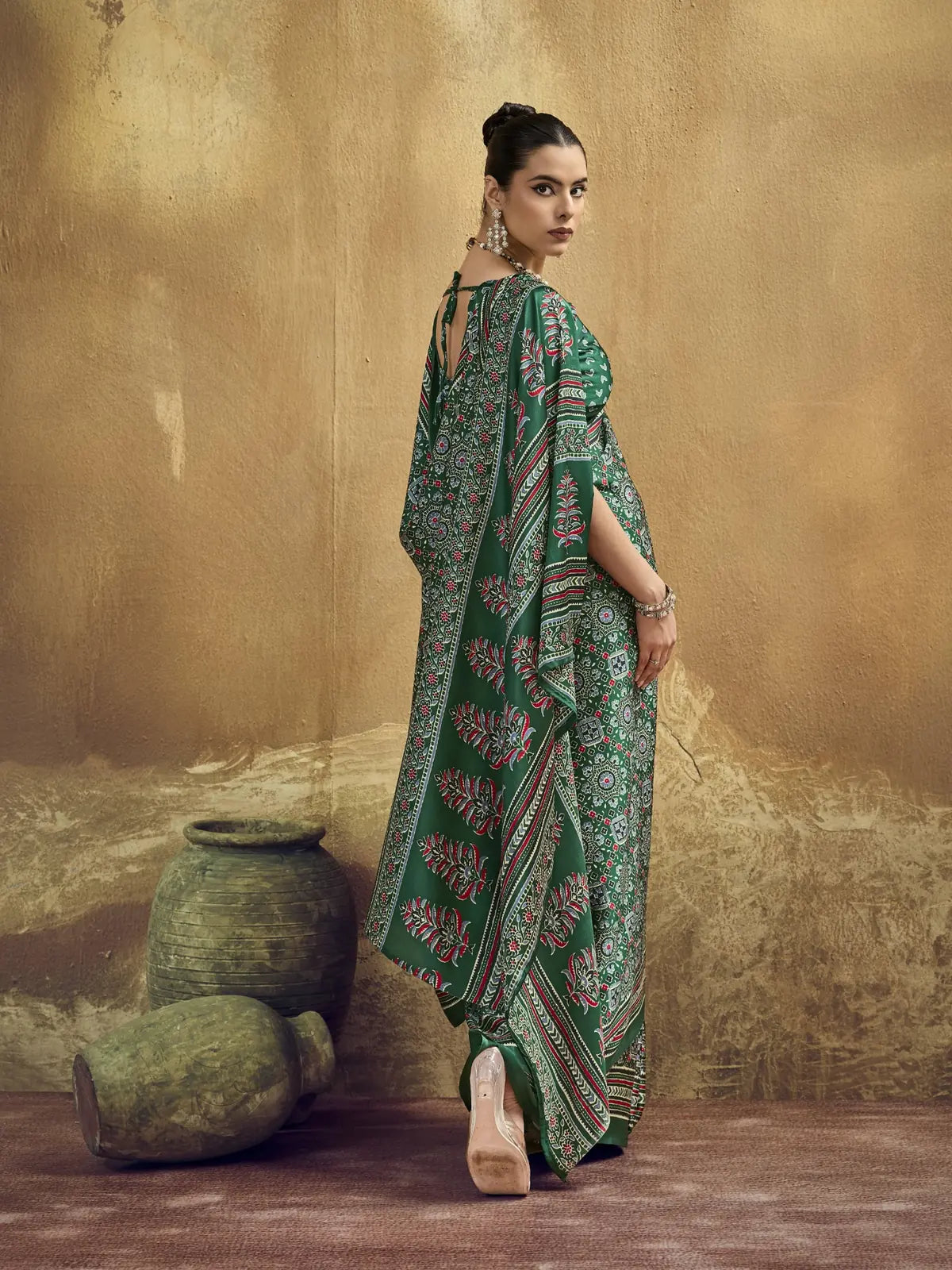 Tarani green modal satin Ajrakh print saree back view showcasing graceful pallu and border