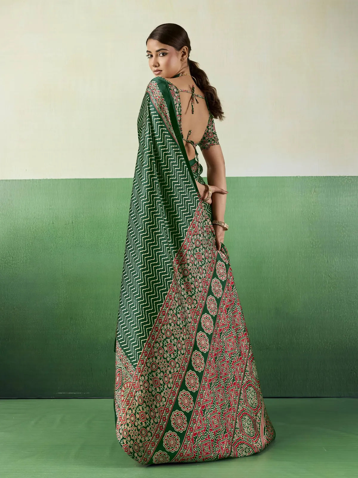 Tarani green modal satin Ajrakh print saree back view showcasing stylish blouse pattern and pallu