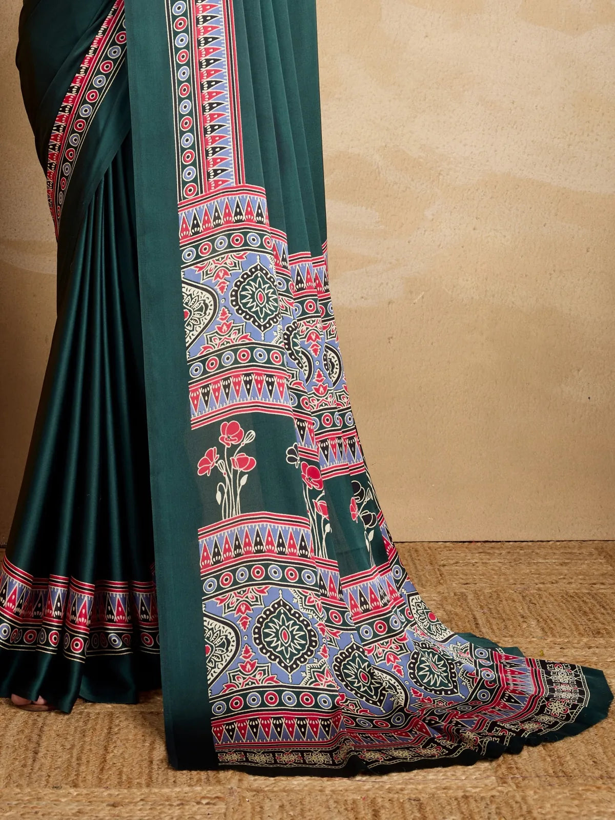 Tarani green modal satin saree pallu and intricate border design with red floral highlights