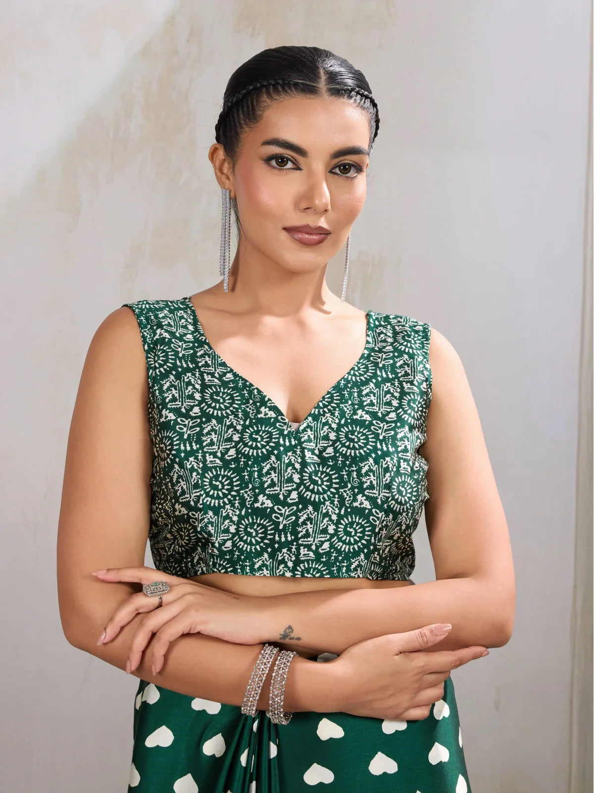 Tarani green modal satin saree close-up showing sleeveless printed blouse with elegant neckline