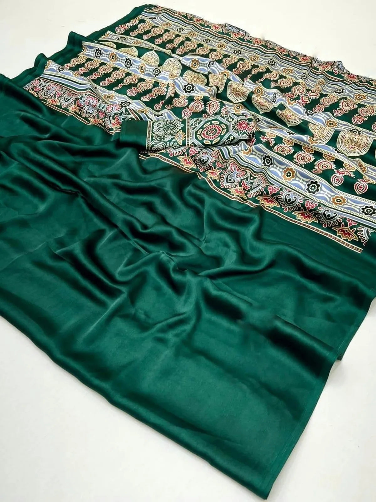 Tarani saree fabric close-up showcasing fine Ajrakh patterns and satin shine