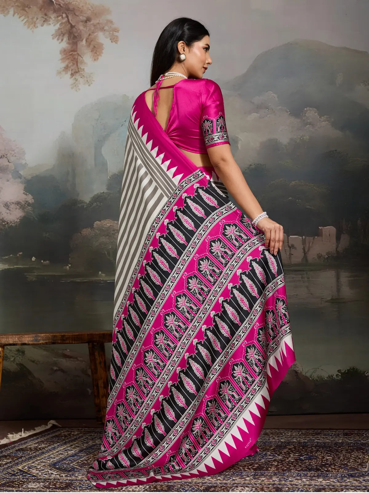 Back view of Tarani grey Ajrakh saree with deep pink blouse and back keyhole tie-up neckline