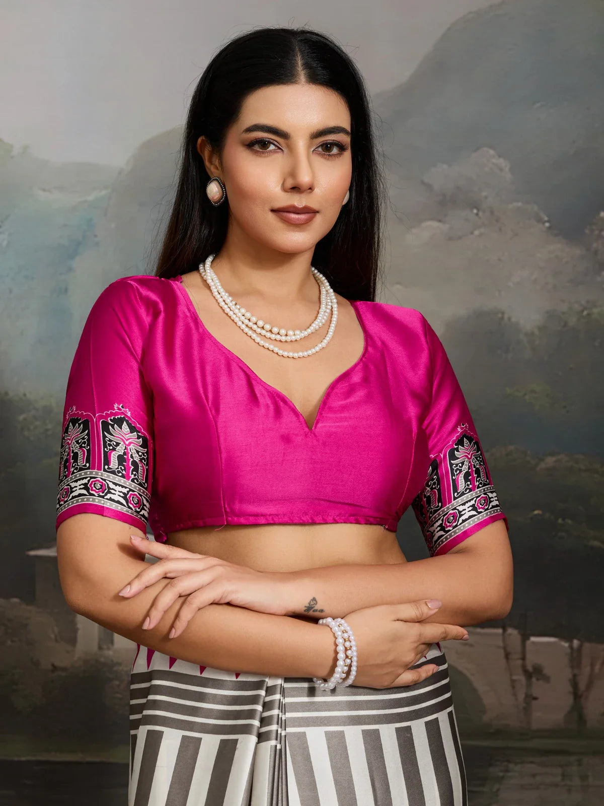 Tarani grey Ajrakh saree with bright pink blouse and embroidered sleeve detail upper body view