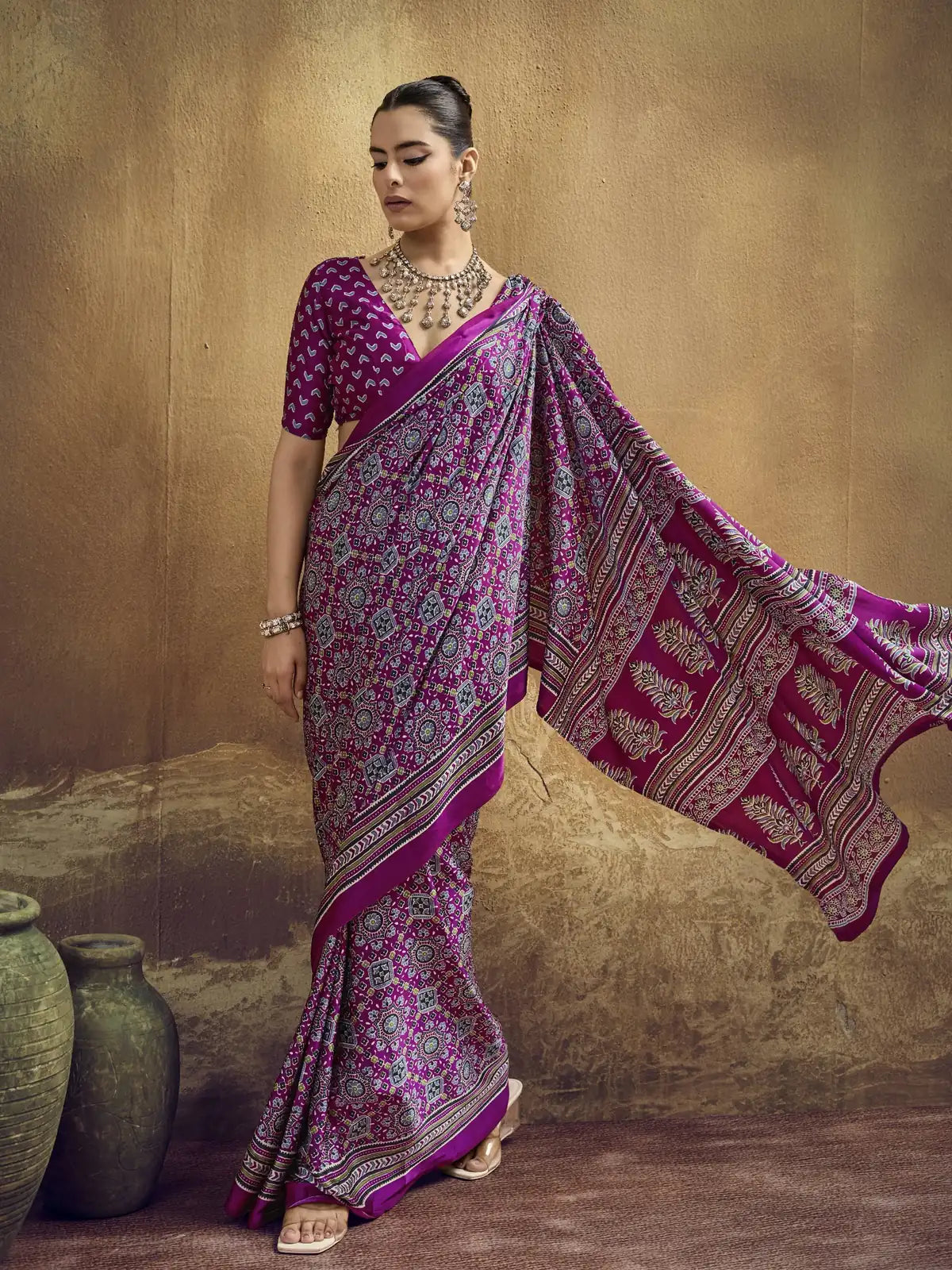 Tarani magenta modal satin saree side view with flowing Ajrakh print pallu