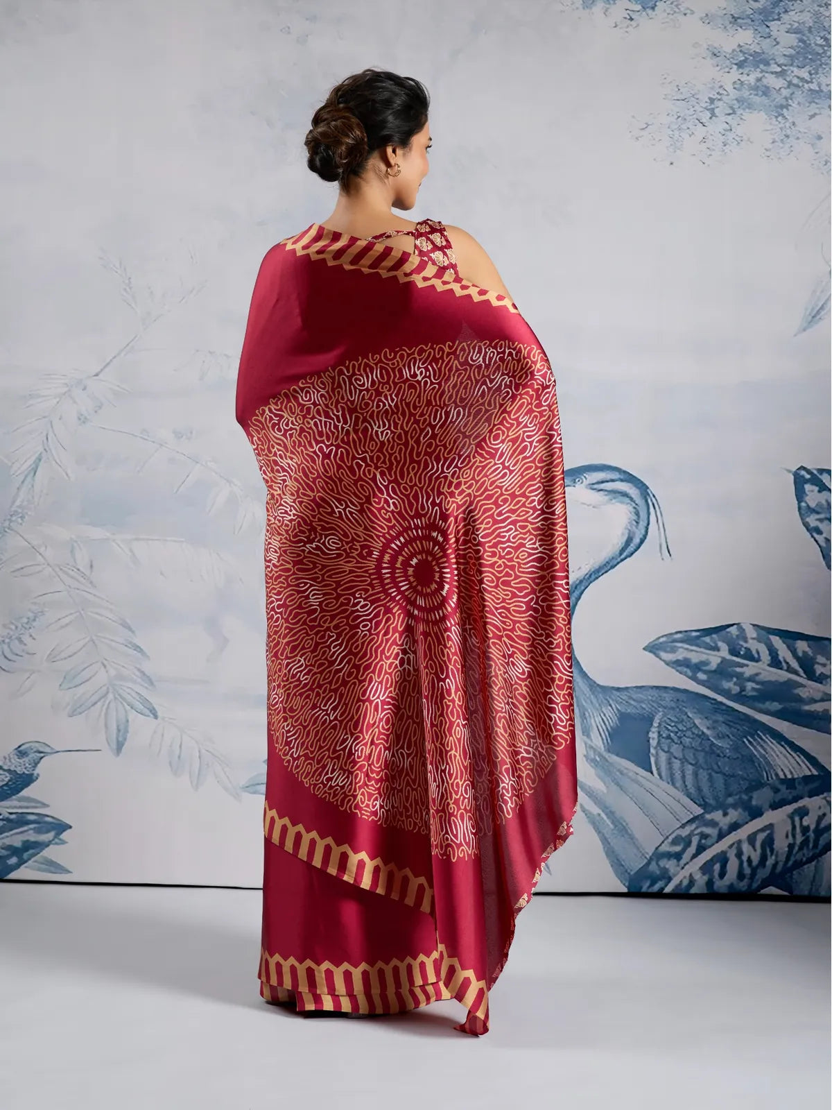 Tarani back view of maroon Ajrakh modal satin saree with traditional print details