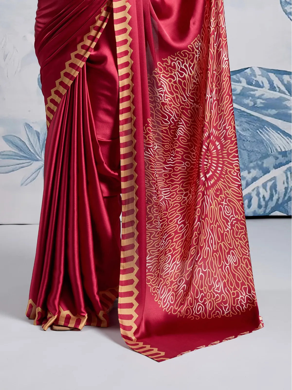 Tarani maroon Ajrakh print pallu with golden radial design in modal satin fabric