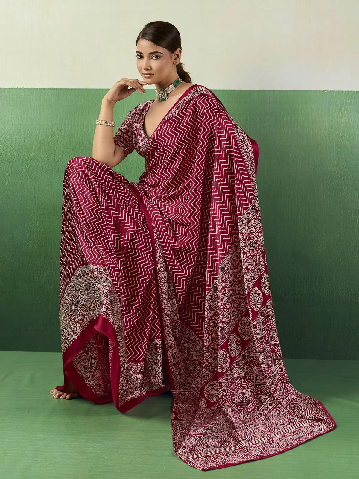 Tarani maroon modal satin Ajrakh print saree side view highlighting pallu and detailed border