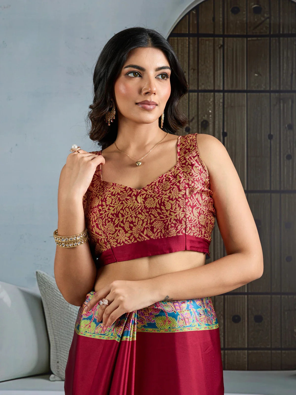 Tarani maroon modal satin saree upper body close up with intricate blouse design