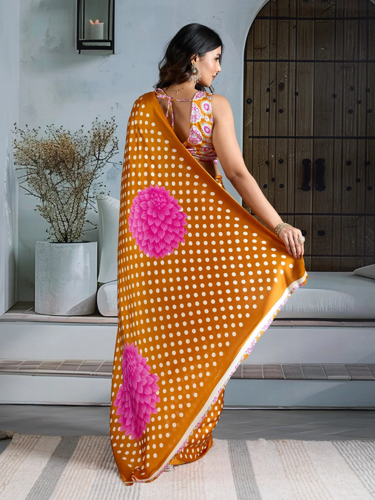 Tarani mustard Ajrakh print saree back view with floral pallu design