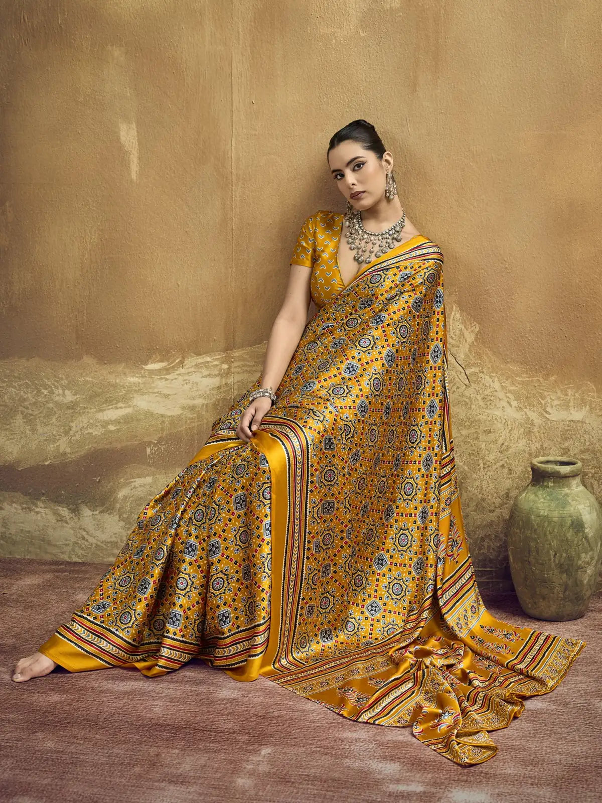 Tarani mustard Ajrakh print modal satin saree stylish sitting full drape view