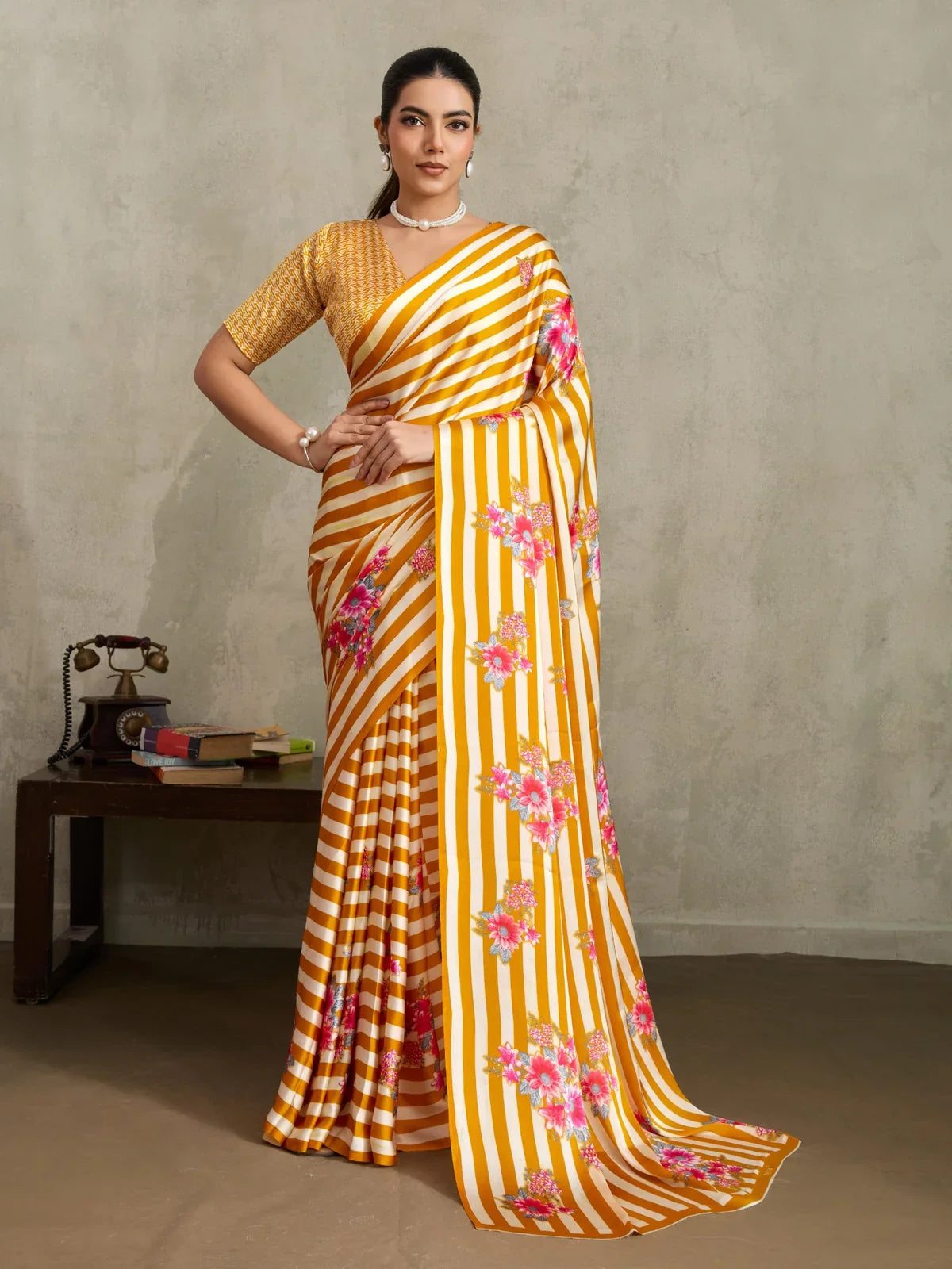 Tarani mustard striped floral saree full view with pink flower prints and contrast yellow printed blouse