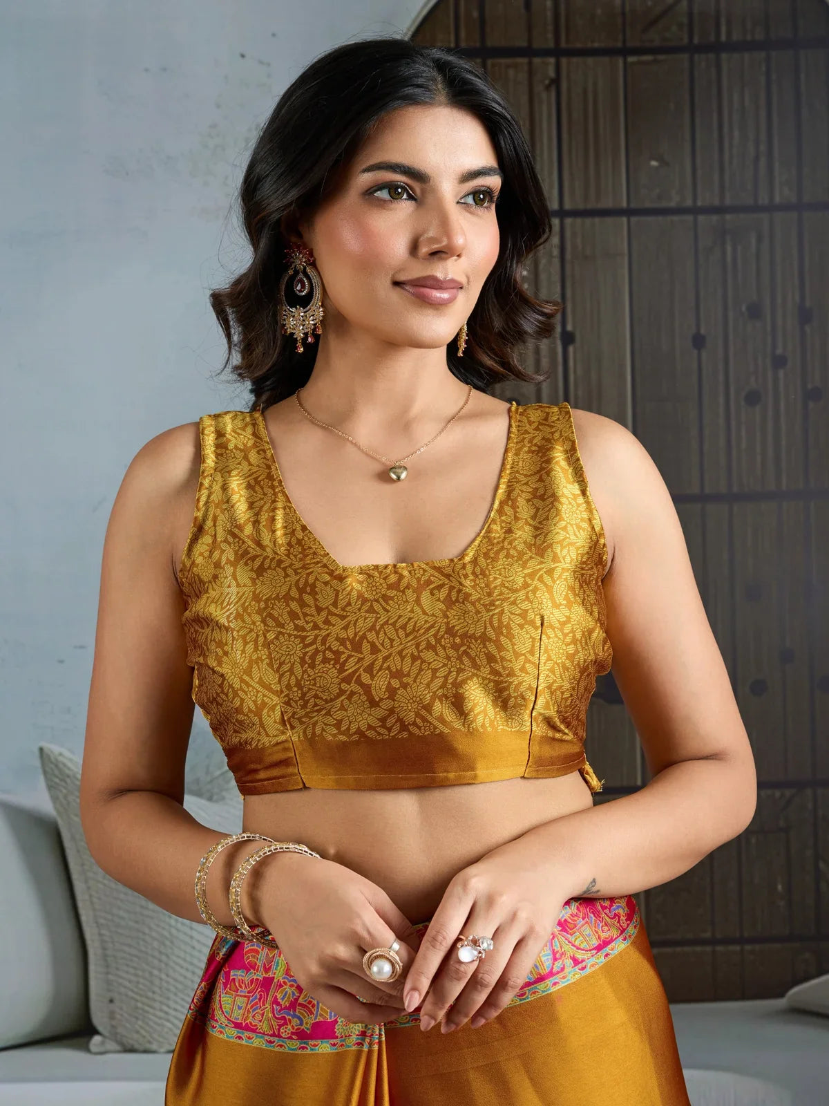 Tarani mustard saree in modal satin fabric showing upper body styling with blouse