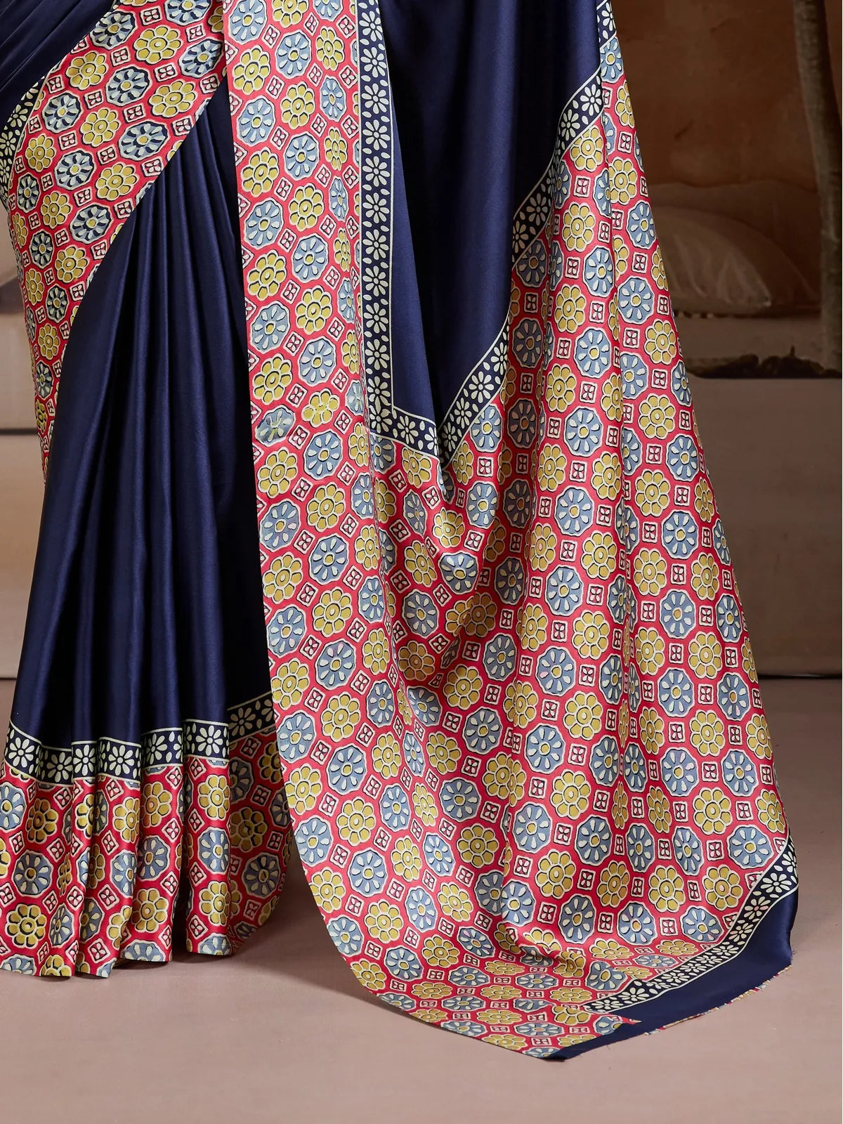Tarani modal satin saree pallu view with multicolor floral design and navy base for festive occasions