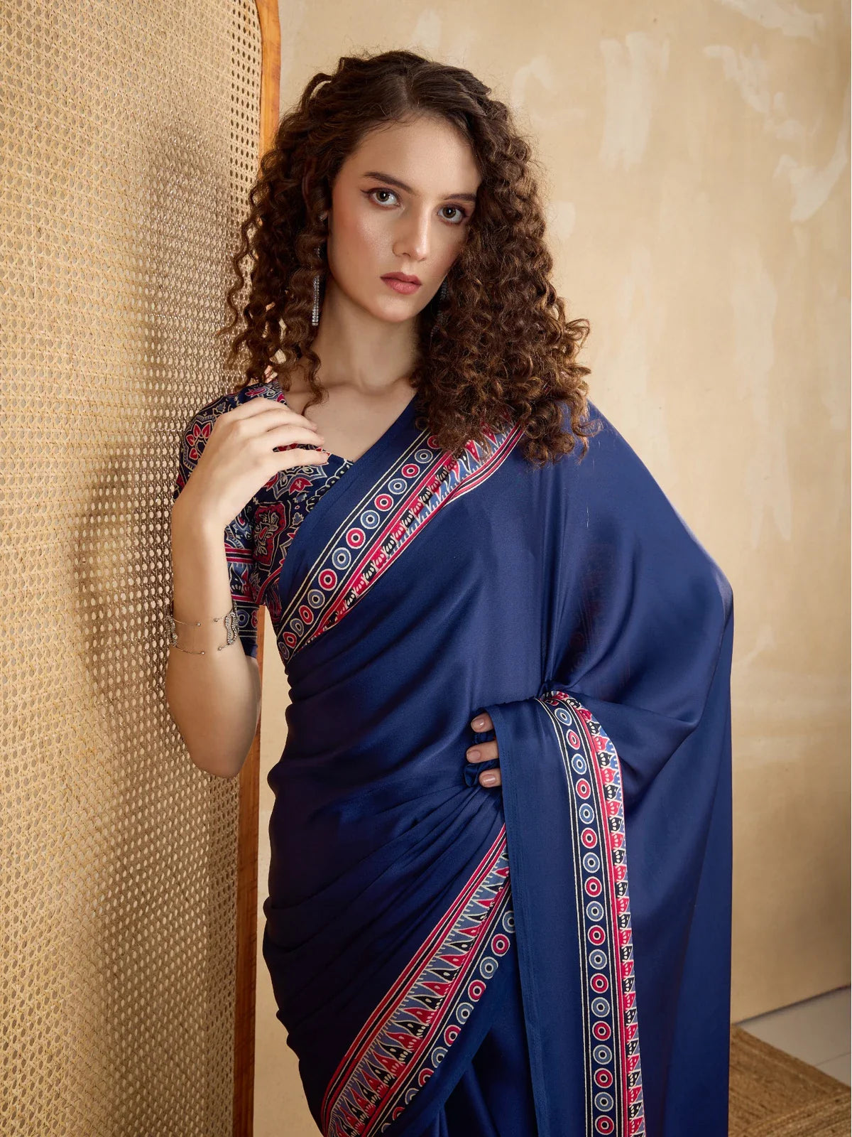 Tarani elegant modal satin saree in navy blue with upper body close-up showing ajrakh border design