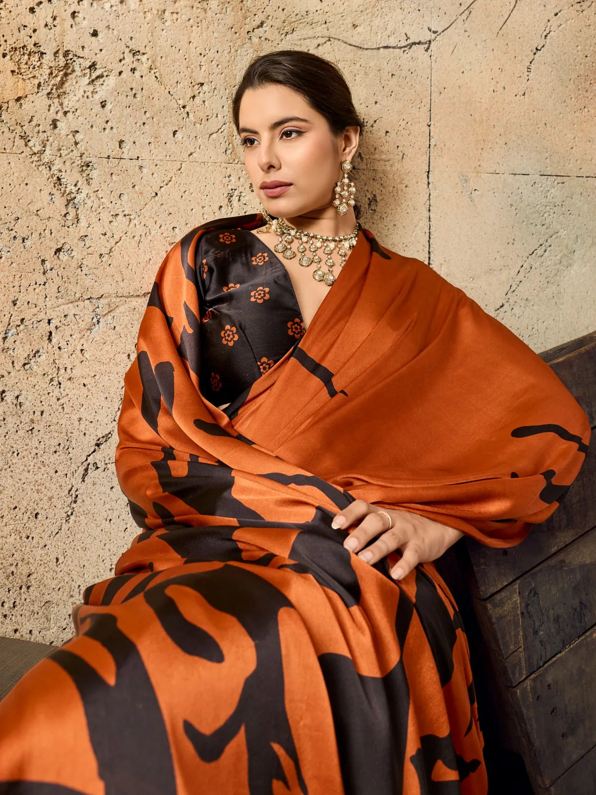 Tarani orange modal satin printed saree closeup view with stylish blouse detailing