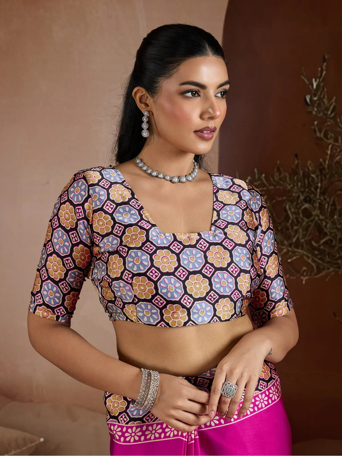 Tarani pink printed blouse with modern cut and detailing in modal satin fabric