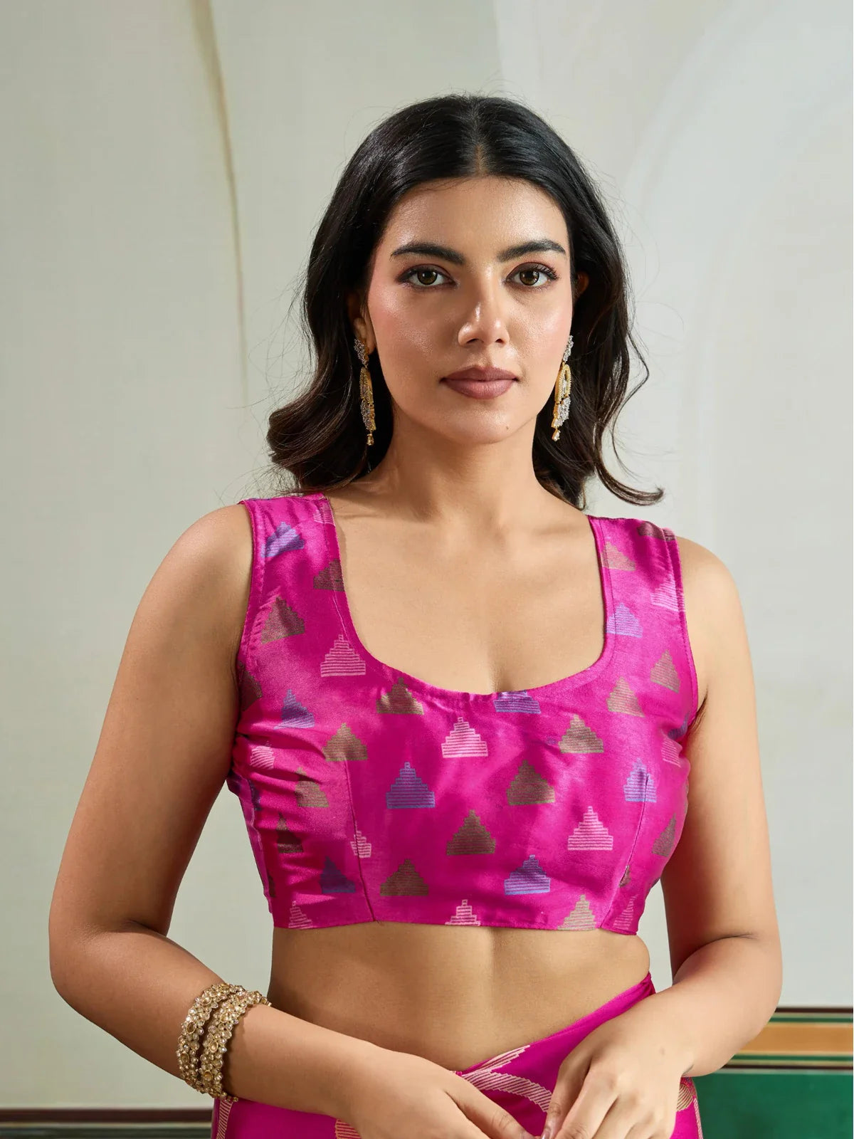 Tarani blouse close-up of modal satin saree in pink with multicolor triangle motifs and modern neckline