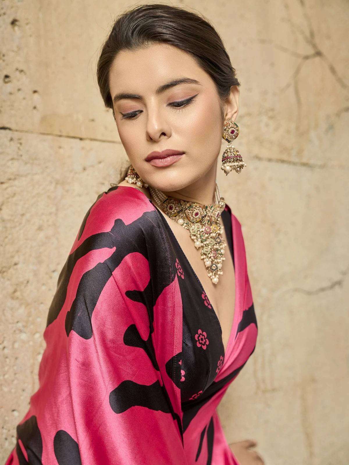 Tarani closeup view of pink modal satin ajrakh saree with stylish printed blouse