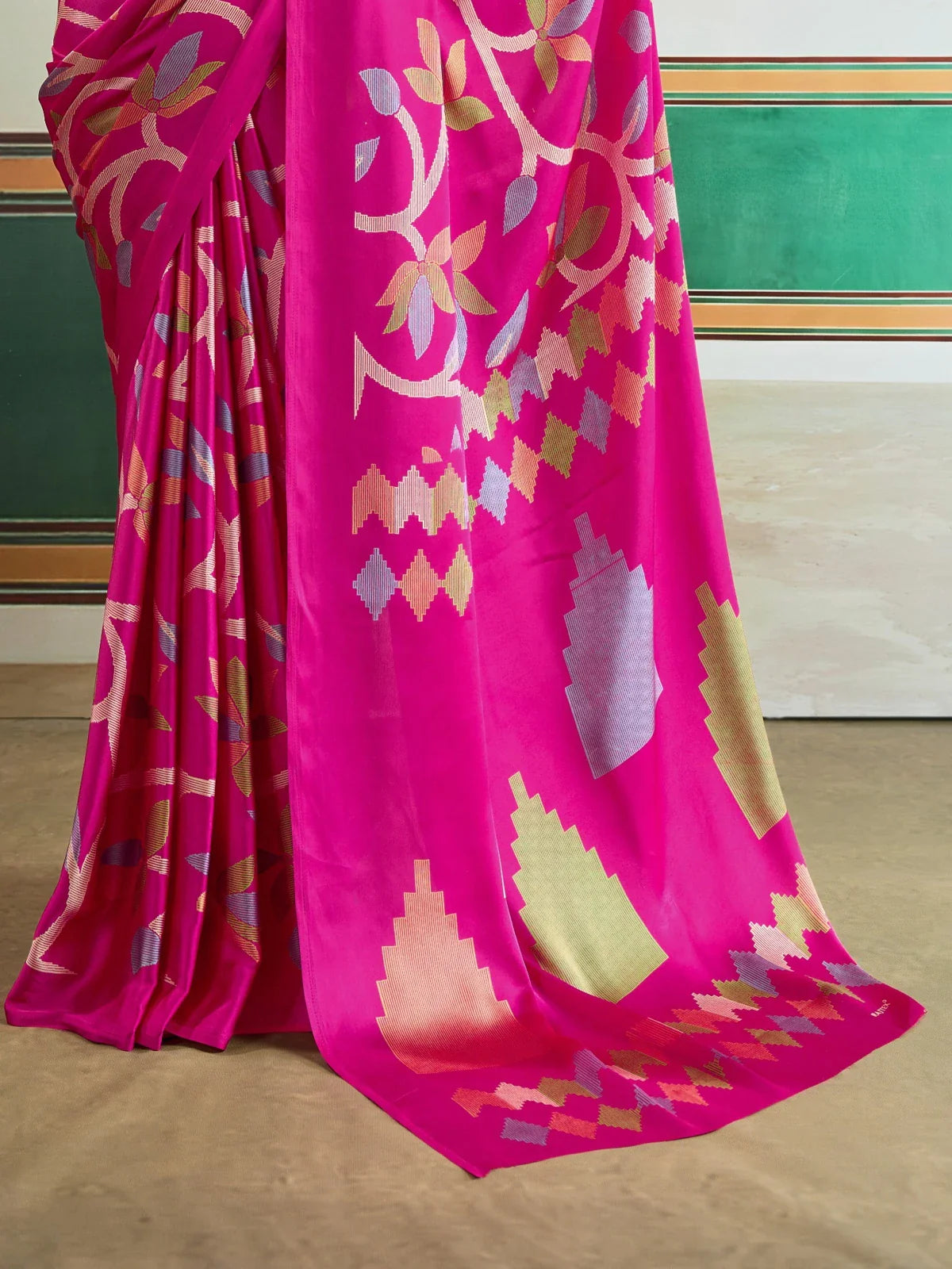 Tarani close-up of modal satin saree fabric showing intricate Ajrakh-inspired patterns in multicolor