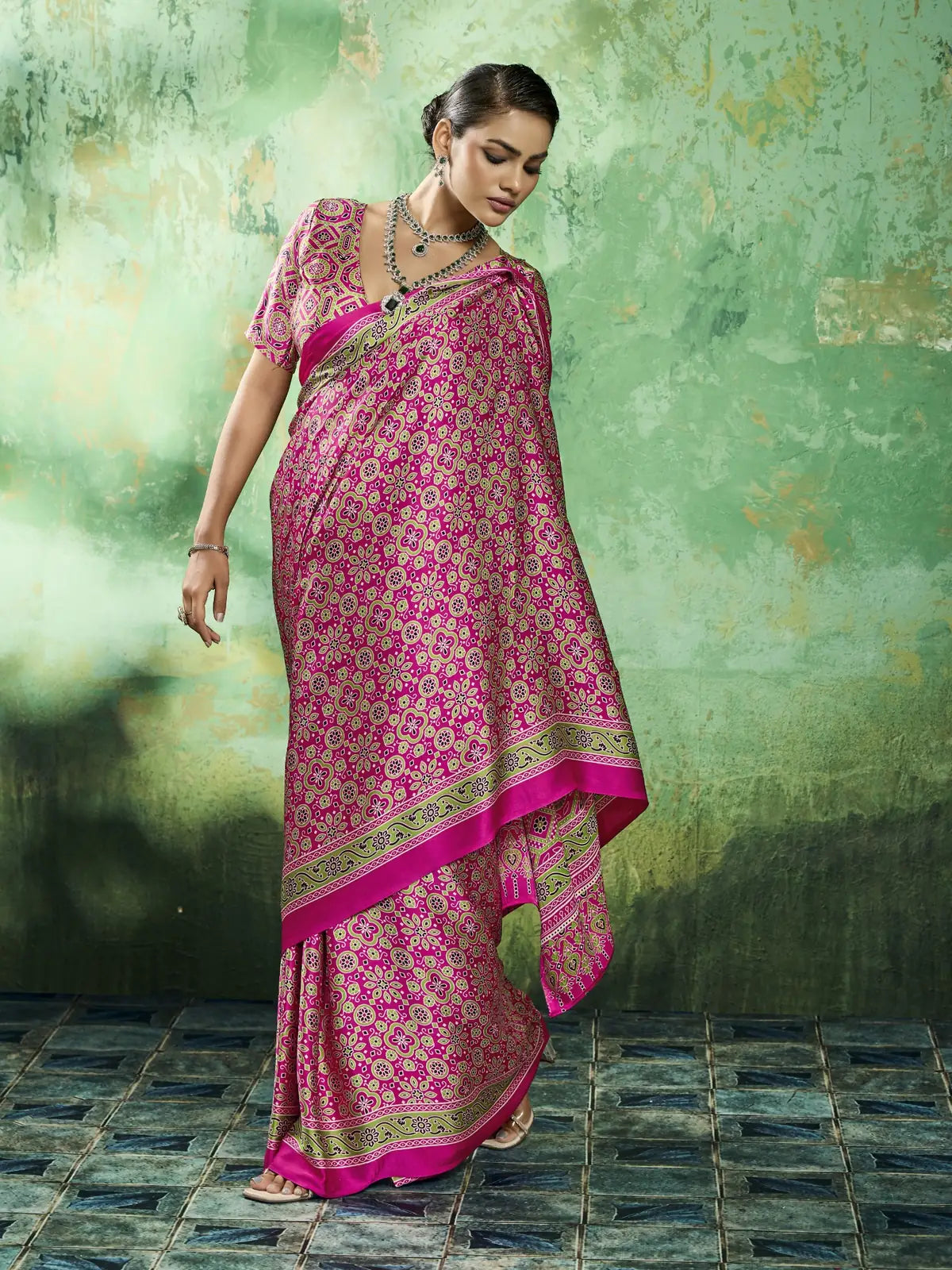 Tarani pink Ajrakh print saree side pose view with elegant modal satin drape and border detailing