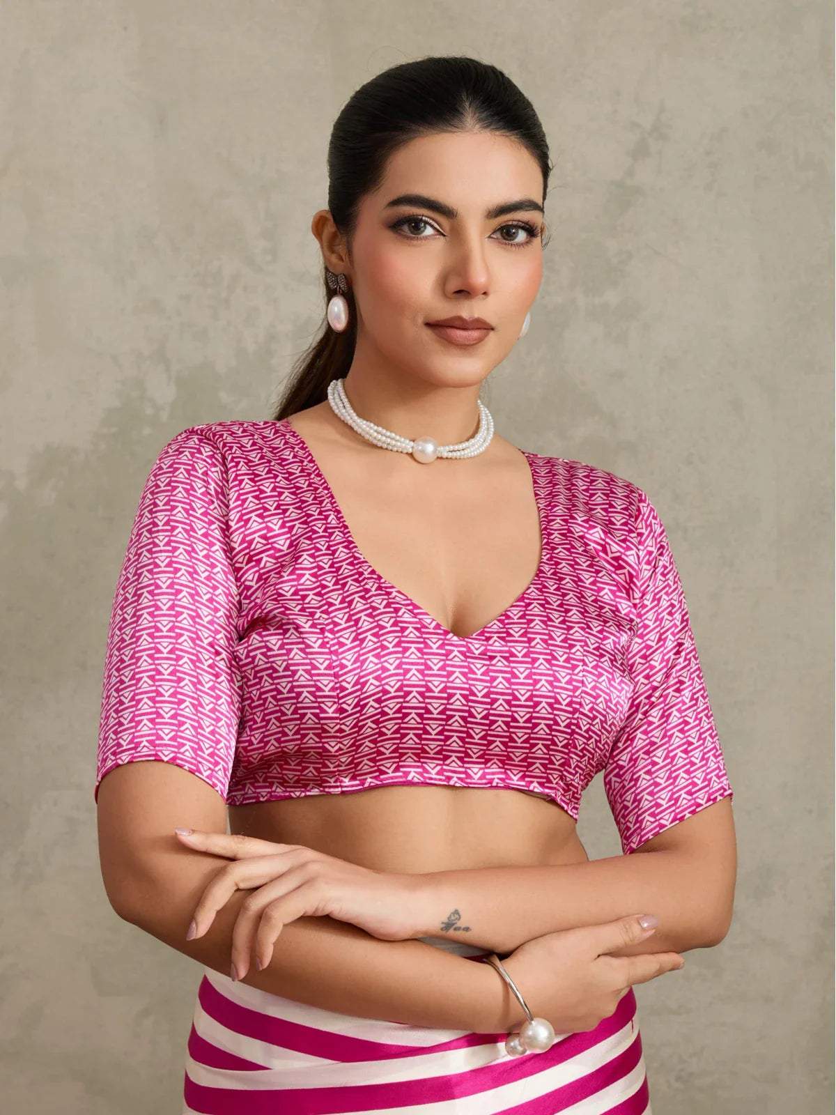 Tarani pink modal satin saree with blouse closeup highlighting neckline and pattern