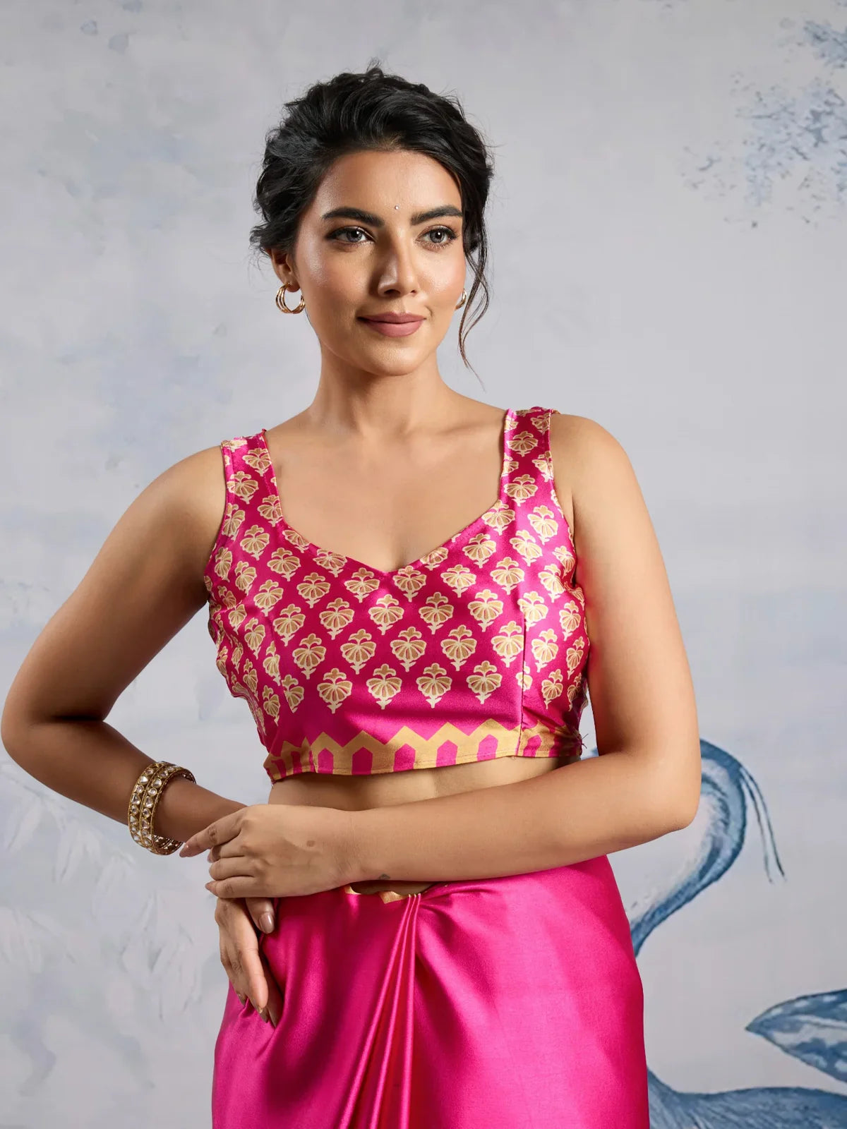 Tarani modal satin pink saree upper body view with designer blouse and golden Ajrakh print